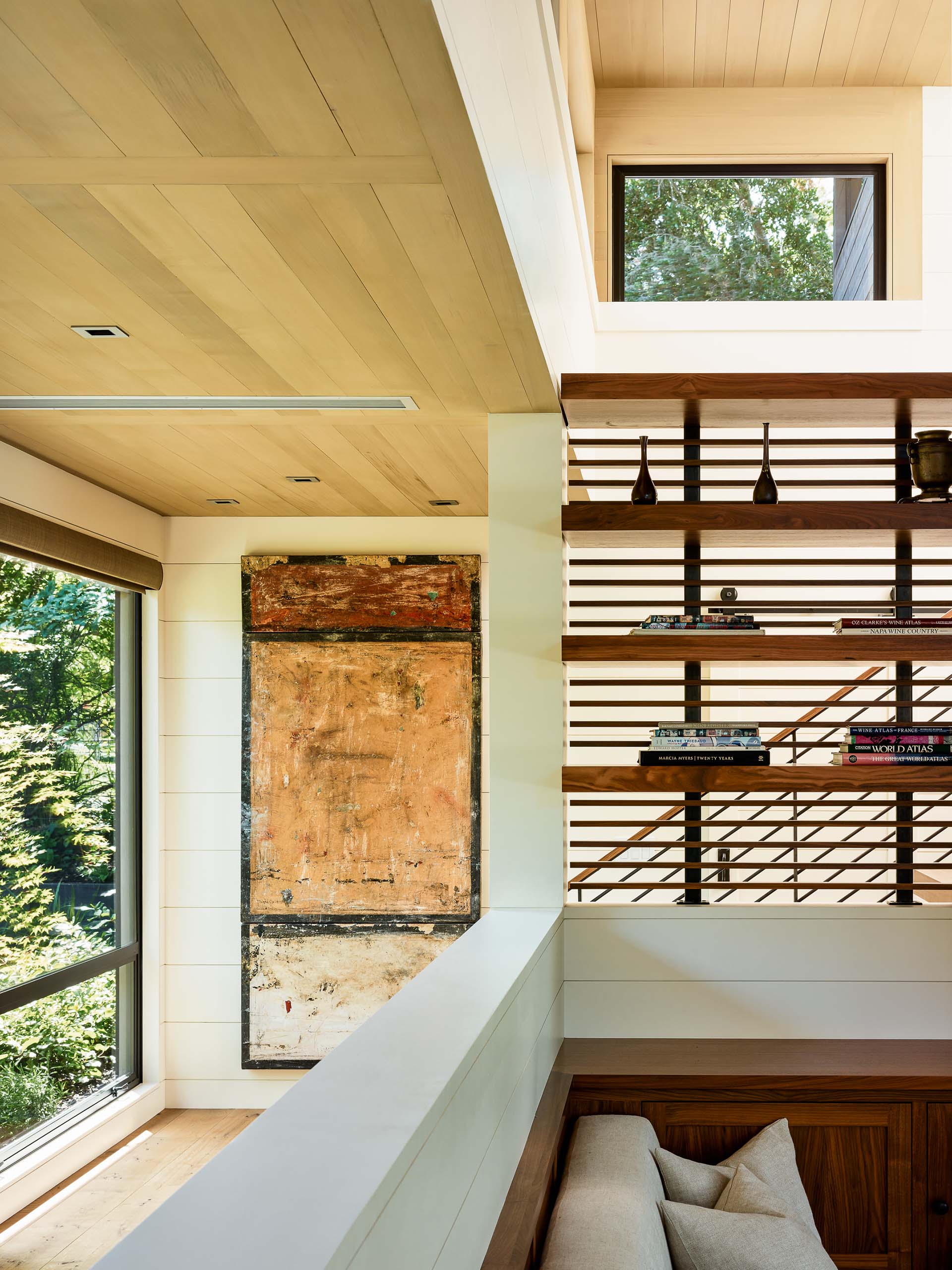 A modern interior with a light wood ceiling.