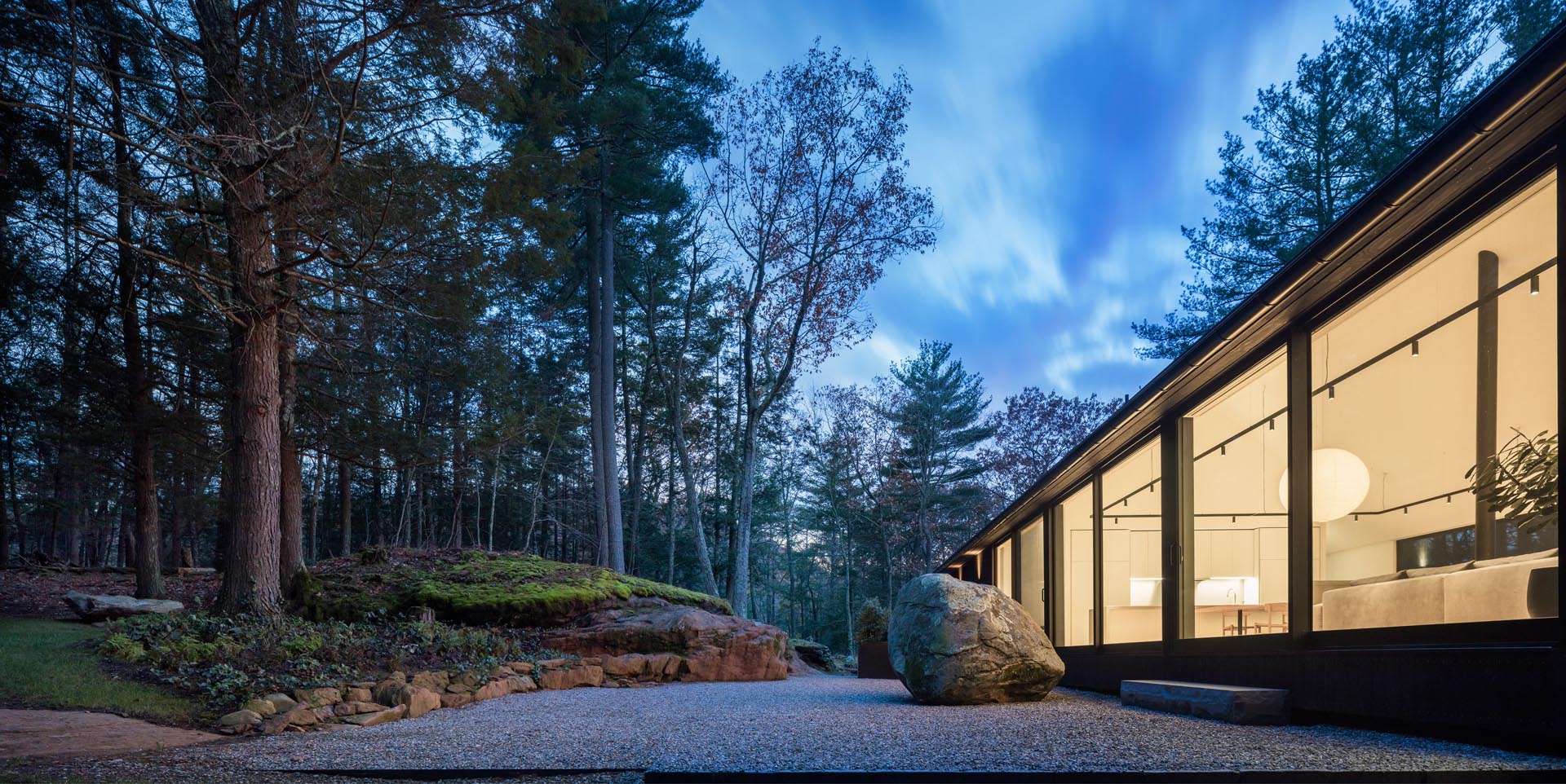 A modern house with a minimalist rock garden.