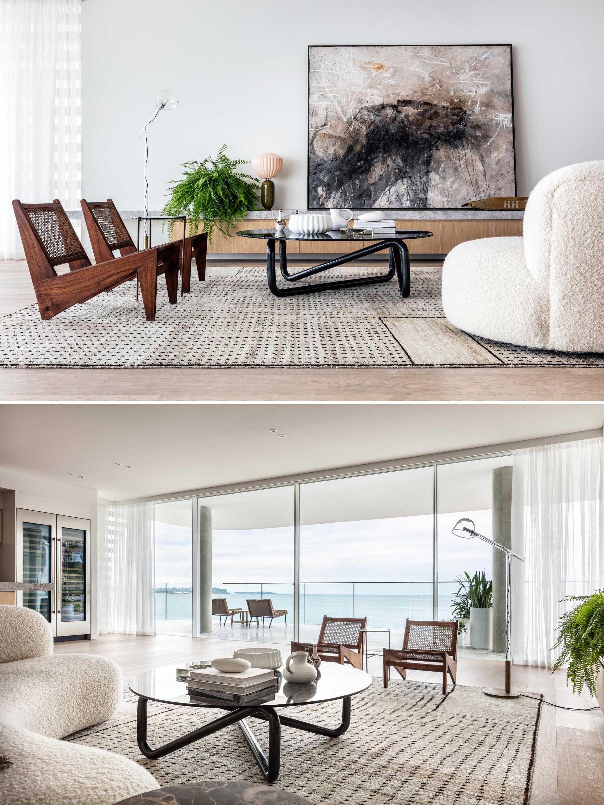 A large rug anchors this living room, while a low cabinet provides a place to display artwork, plants, and decor, and a curved sofa keeps things casual.