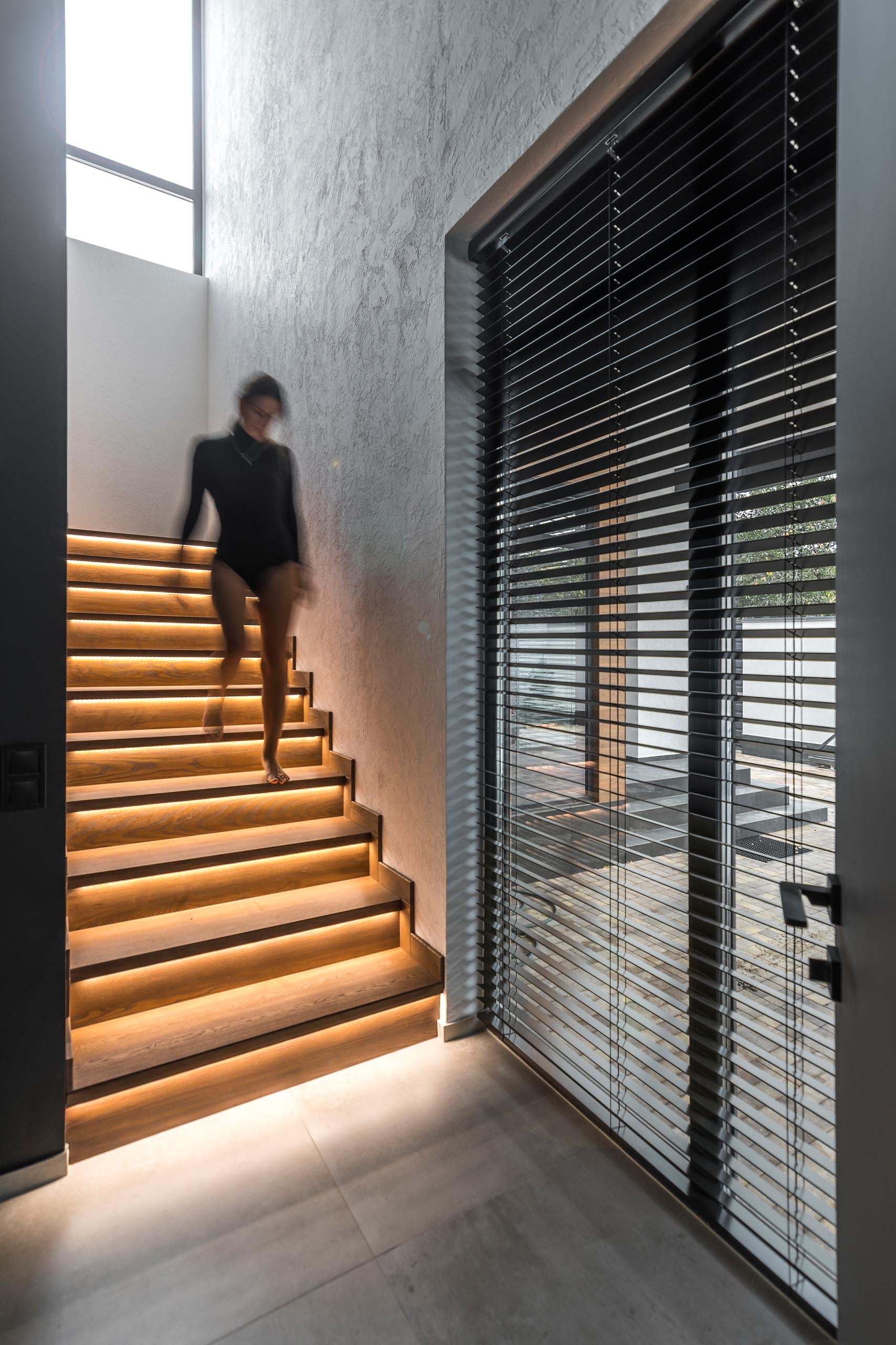 Modern wood stairs that have hidden lighting.