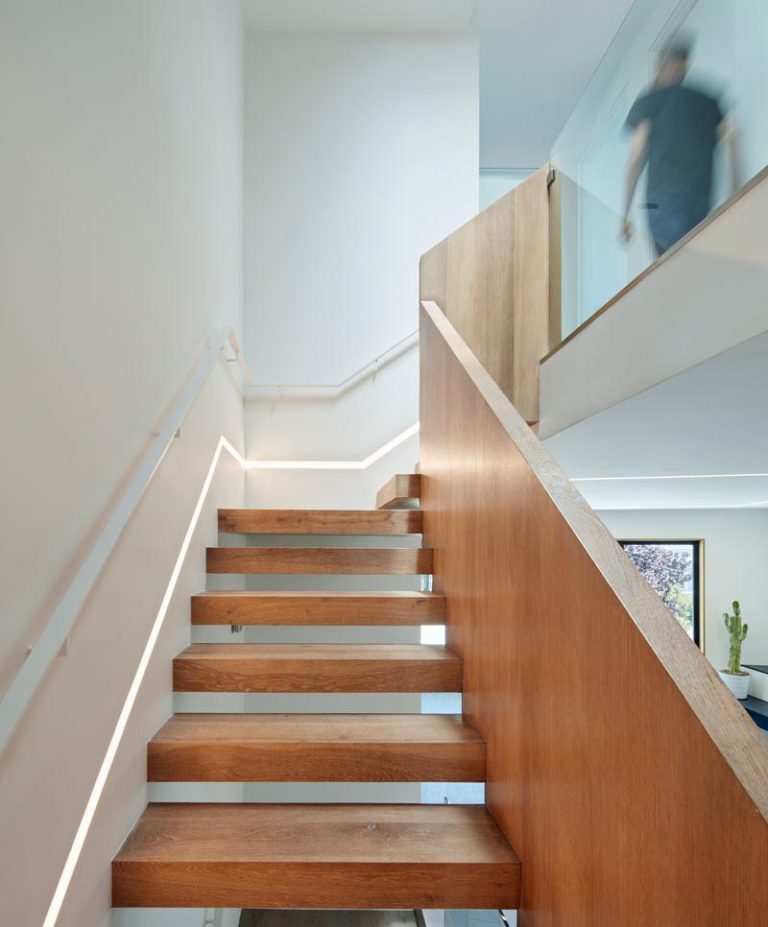 These Wood Stairs Have A Strip Of Lighting Built Into The Wall