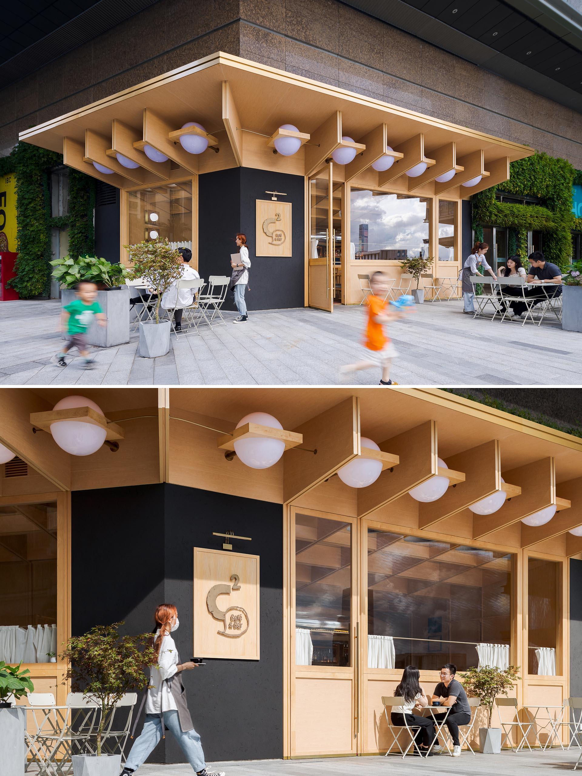 A modern cafe and bar with a wood exterior and outdoor seating.