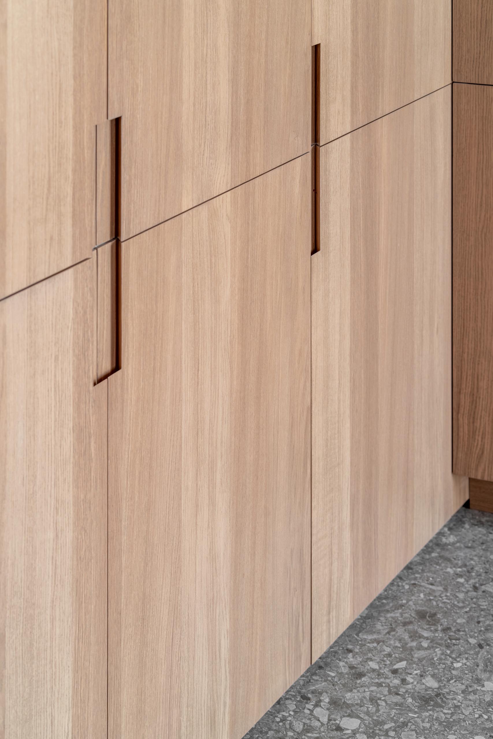 Modern wood hardware free kitchen cabinets.
