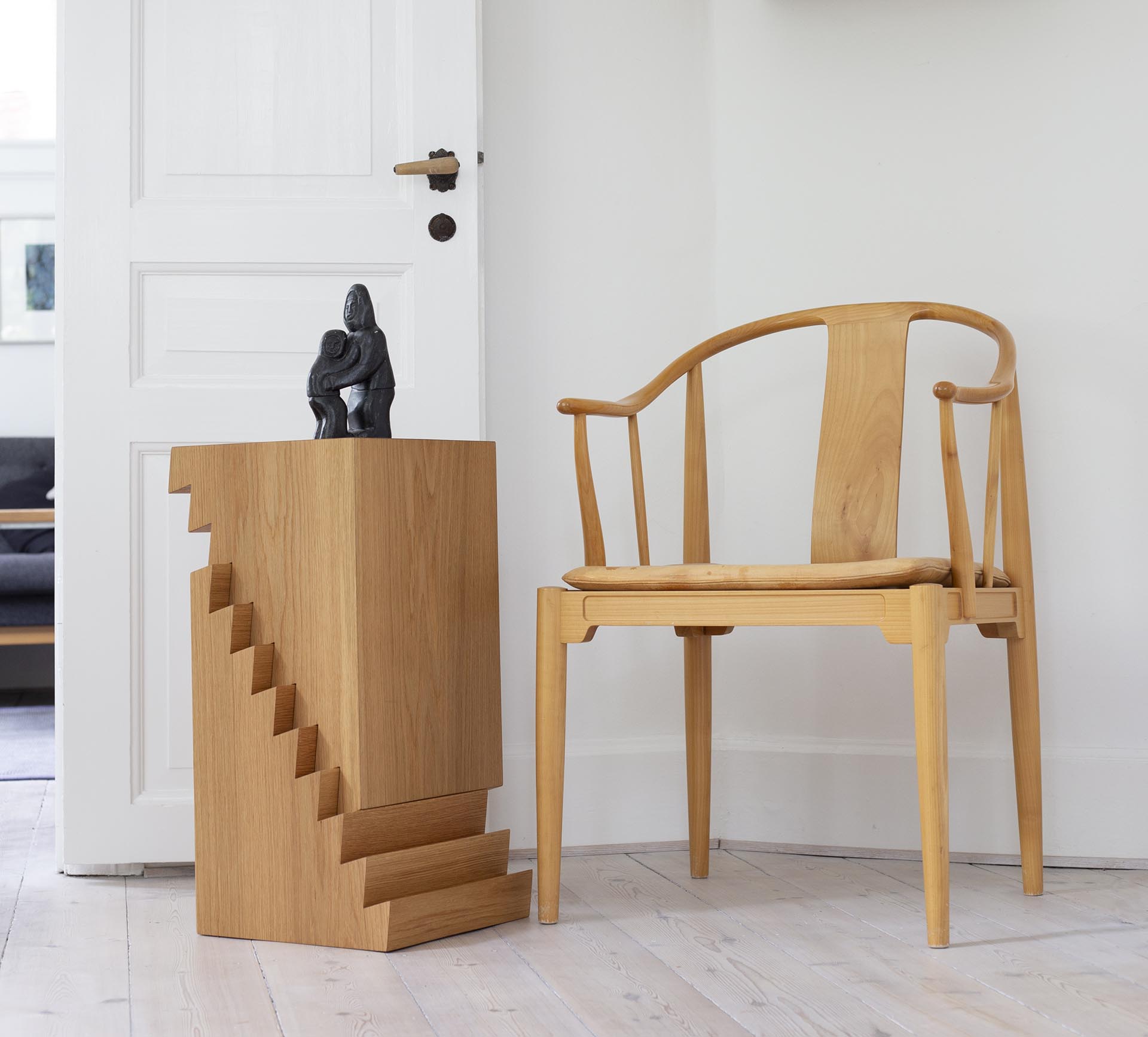 An adjustable side table with a saw-tooth design.