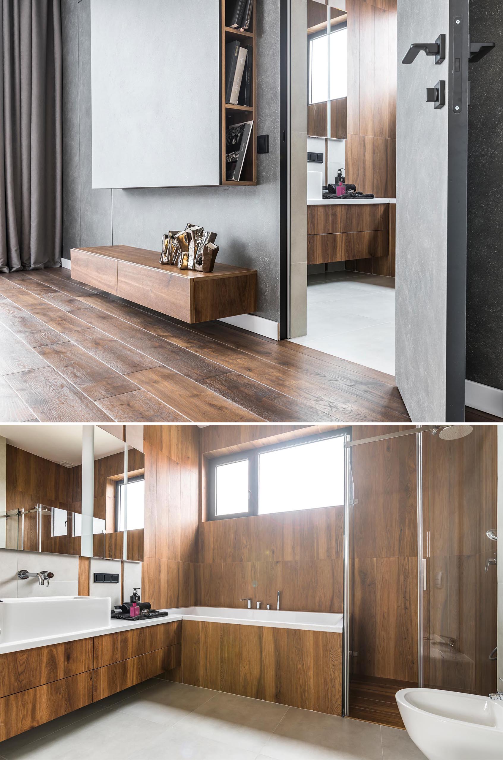 A modern wood-like tile covers a bathroom that also includes a white counter and sink.