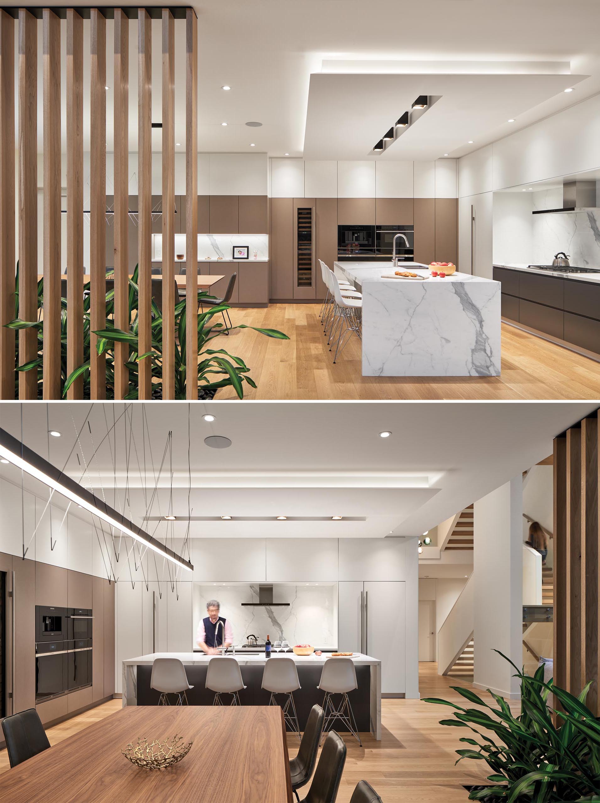 In this modern dining room and kitchen, a wall of tan cabinetry connects the two spaces. In the kitchen, a large island creates additional counter space and room for seating, while the black and white cabinets have a more minimalist look.