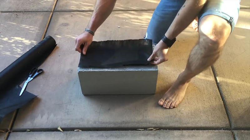 Create your own inexpensive, modern and fully customizable DIY outdoor succulent planter using cinder blocks, landscaping fabric, cactus soil, and succulents.