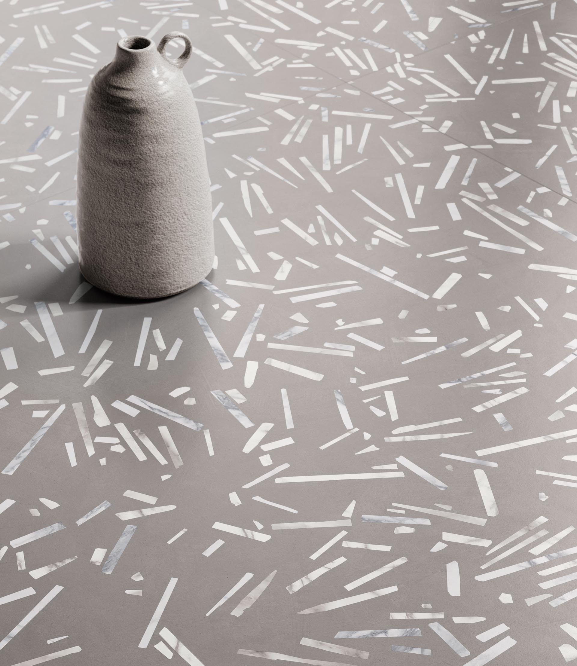 Wall and floor tiles with a confetti-like appearance.