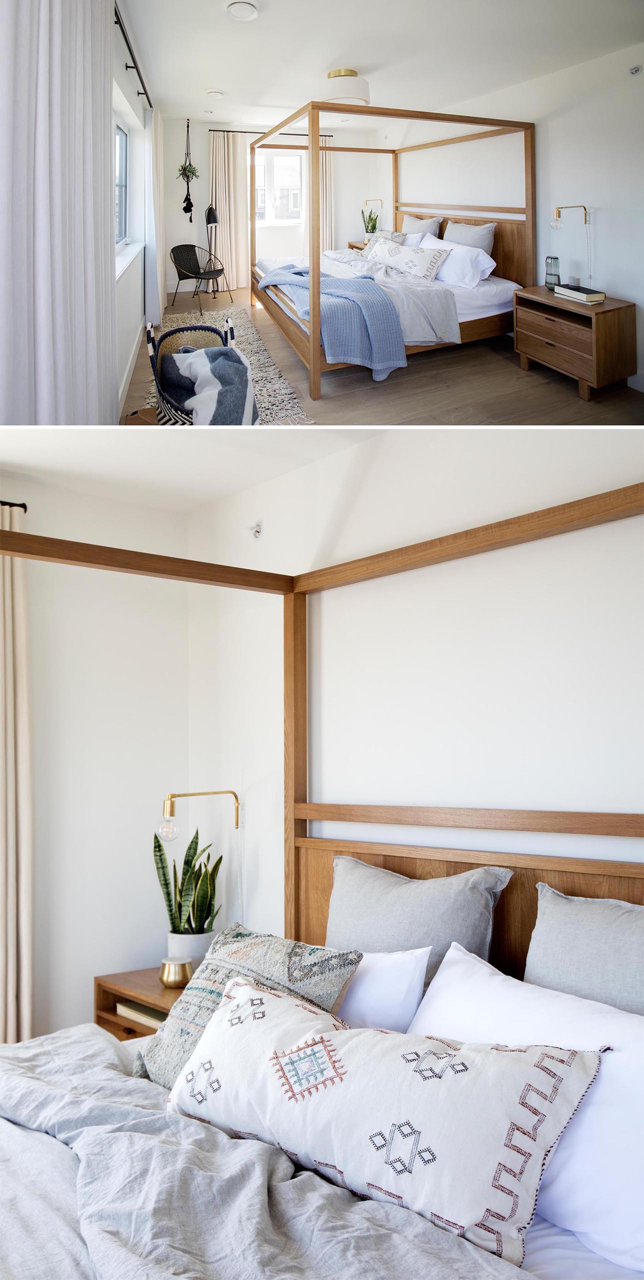 In this master bedroom, a contemporary wood framed four poster bed catches the eye. Other furnishings include wood bedside tables, a black chair, wall-mounted bedside lamps, a hanging plant in the corner, and a rug.