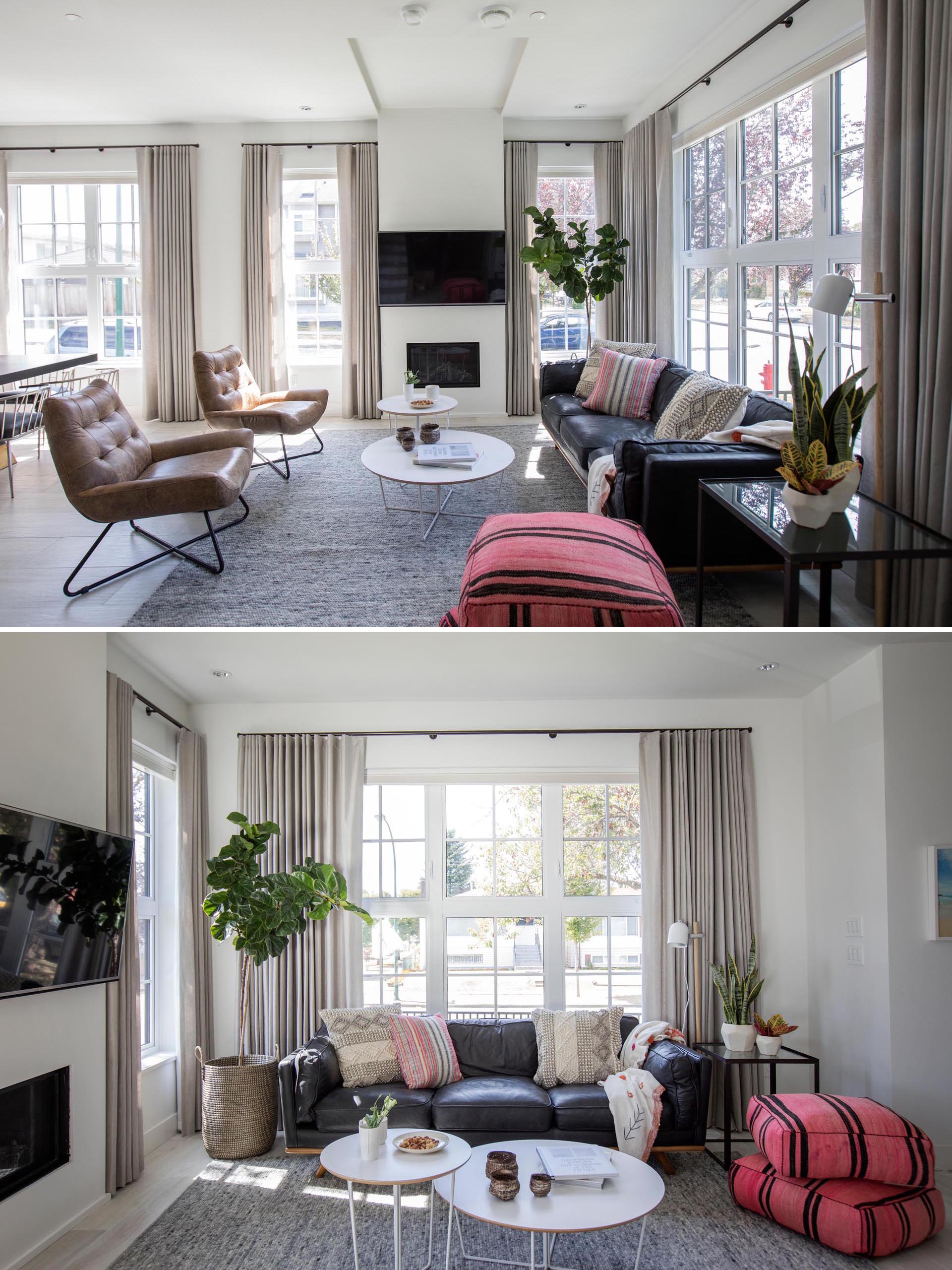 An abundance of windows in this modern living room allows for natural light to flood the interior and at the same time provides views of the street.