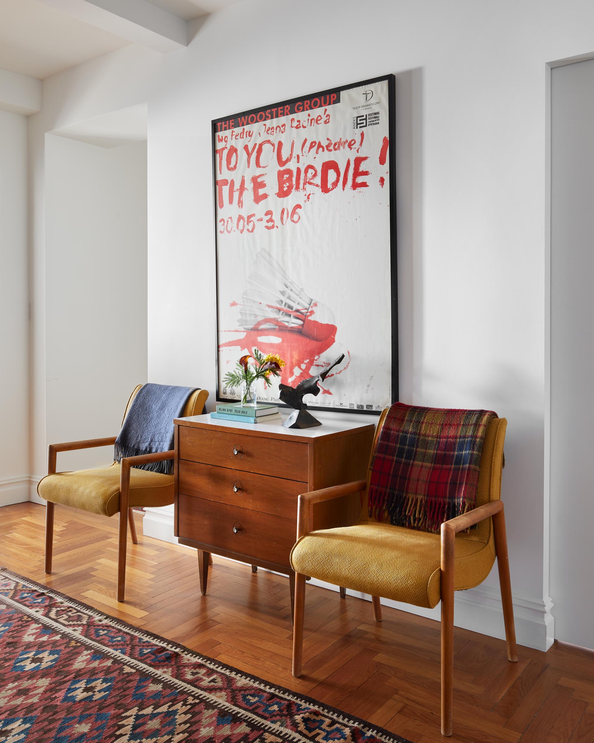 A remodeled entryway with mid-century modern furniture.