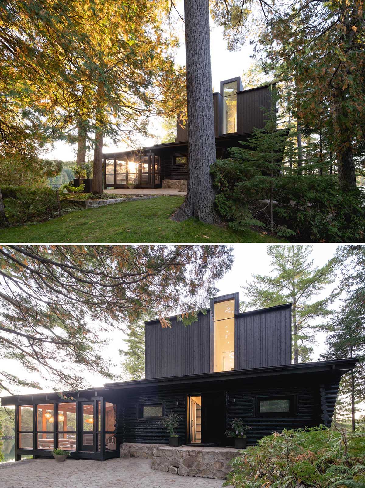 A log cabin with a stone foundation has a modern extension and porch.