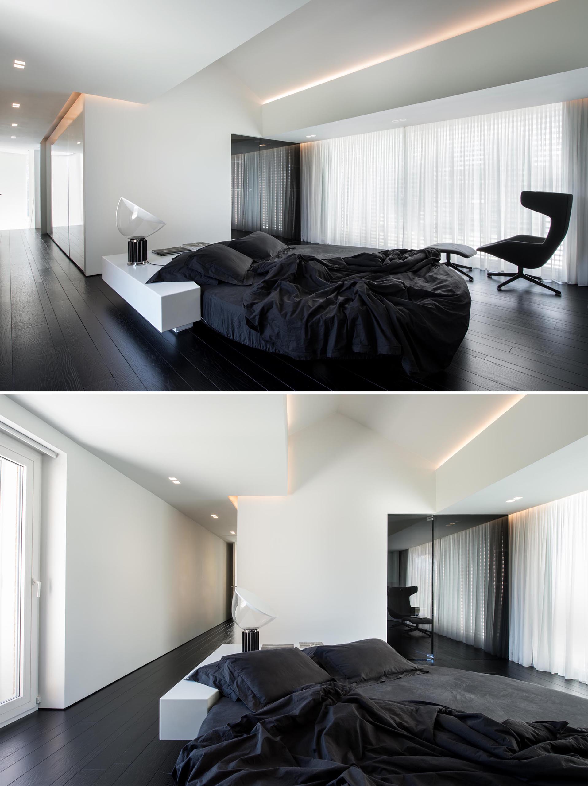 A modern bedroom with a black and white color palette, and a round bed.