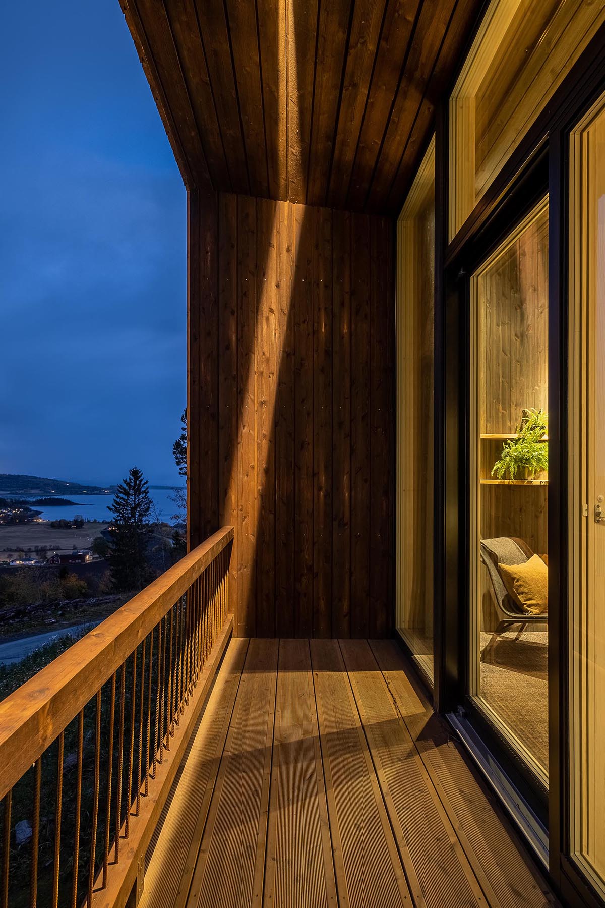 A hotel room with a covered balcony.