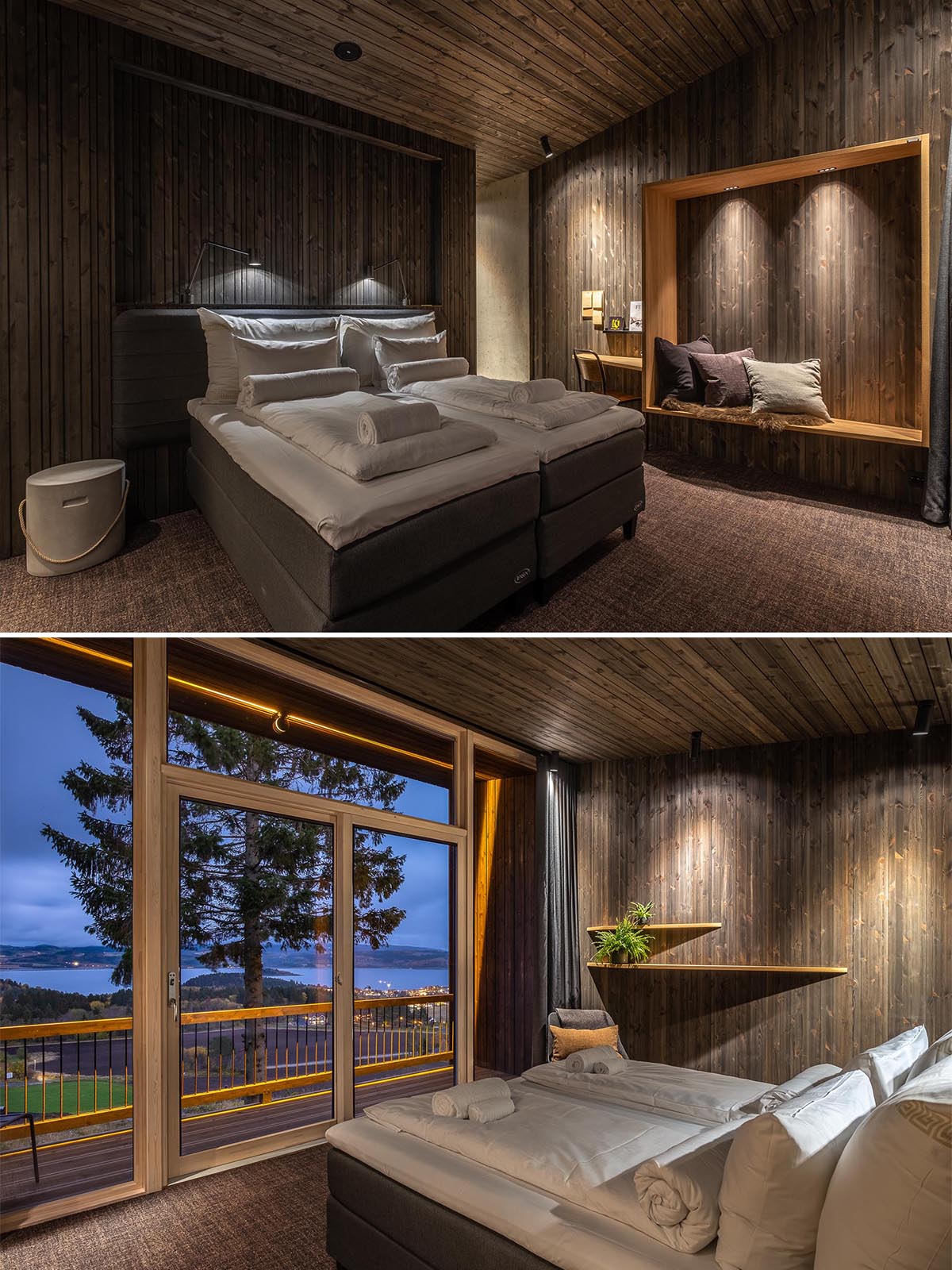 A hotel room interior with dark wood walls, curtains, and furniture, and built-in bench seating.