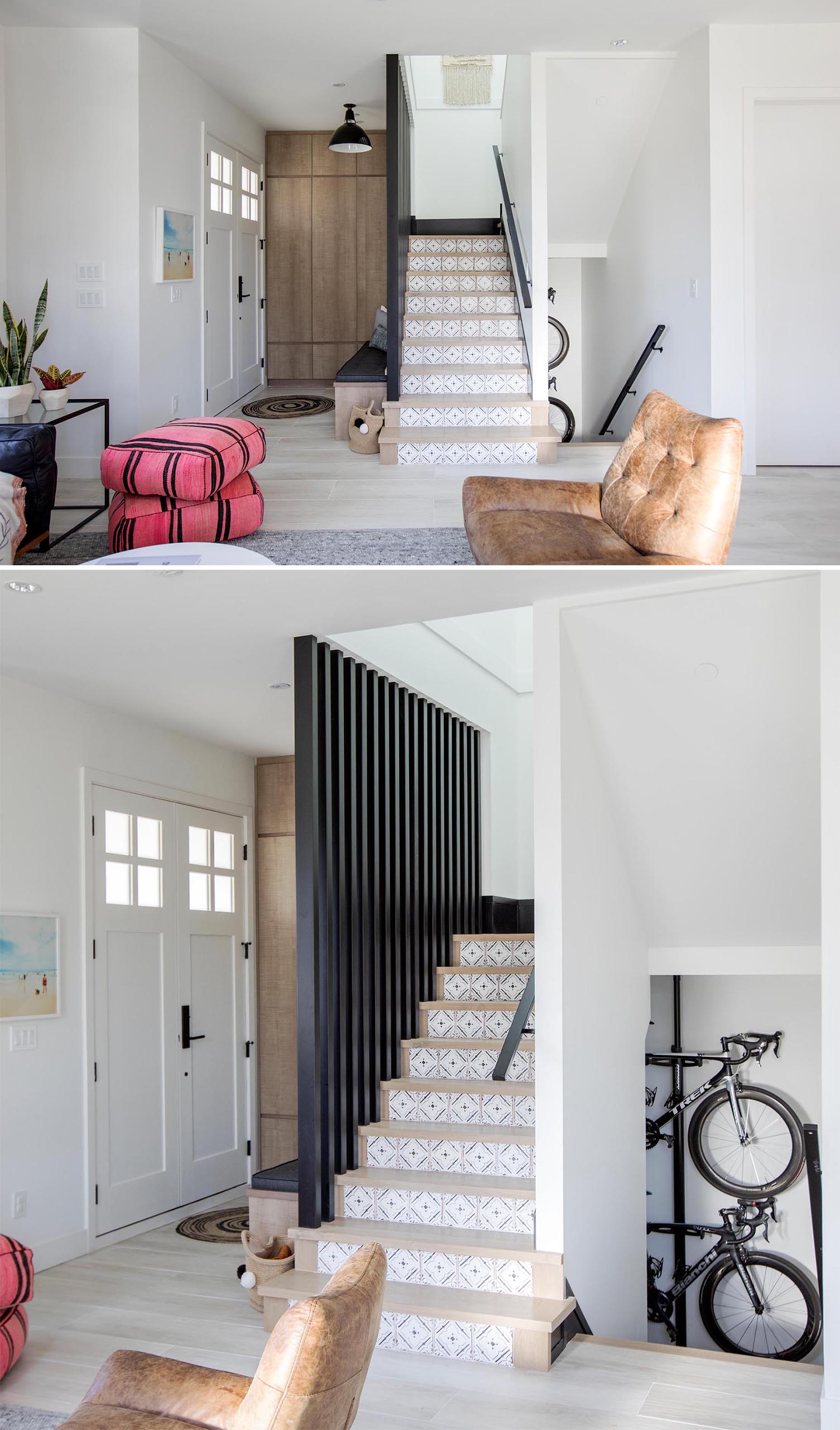 This modern home has a a small entryway furnished with a wood bench and a black upholstered cushion.