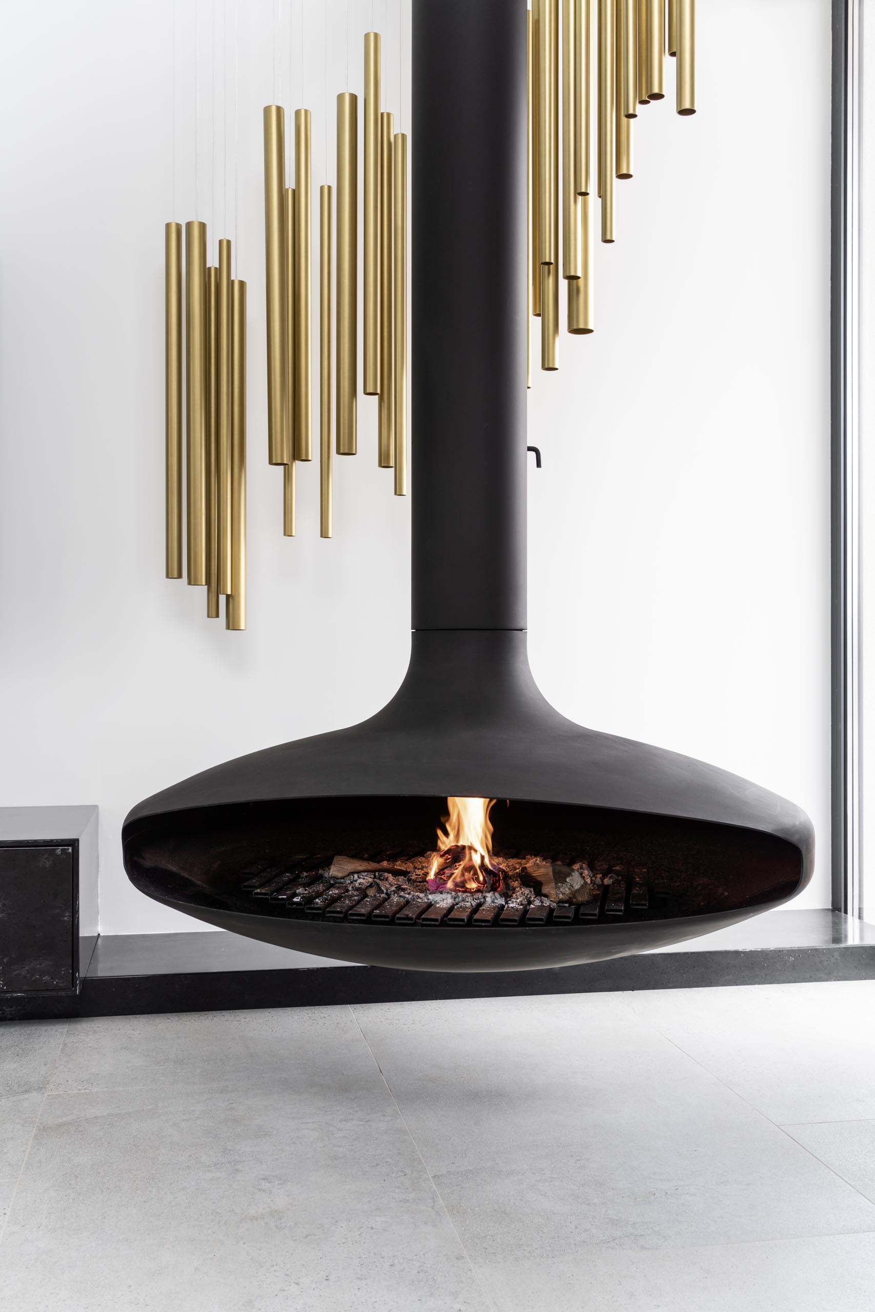 A suspended black fireplace.