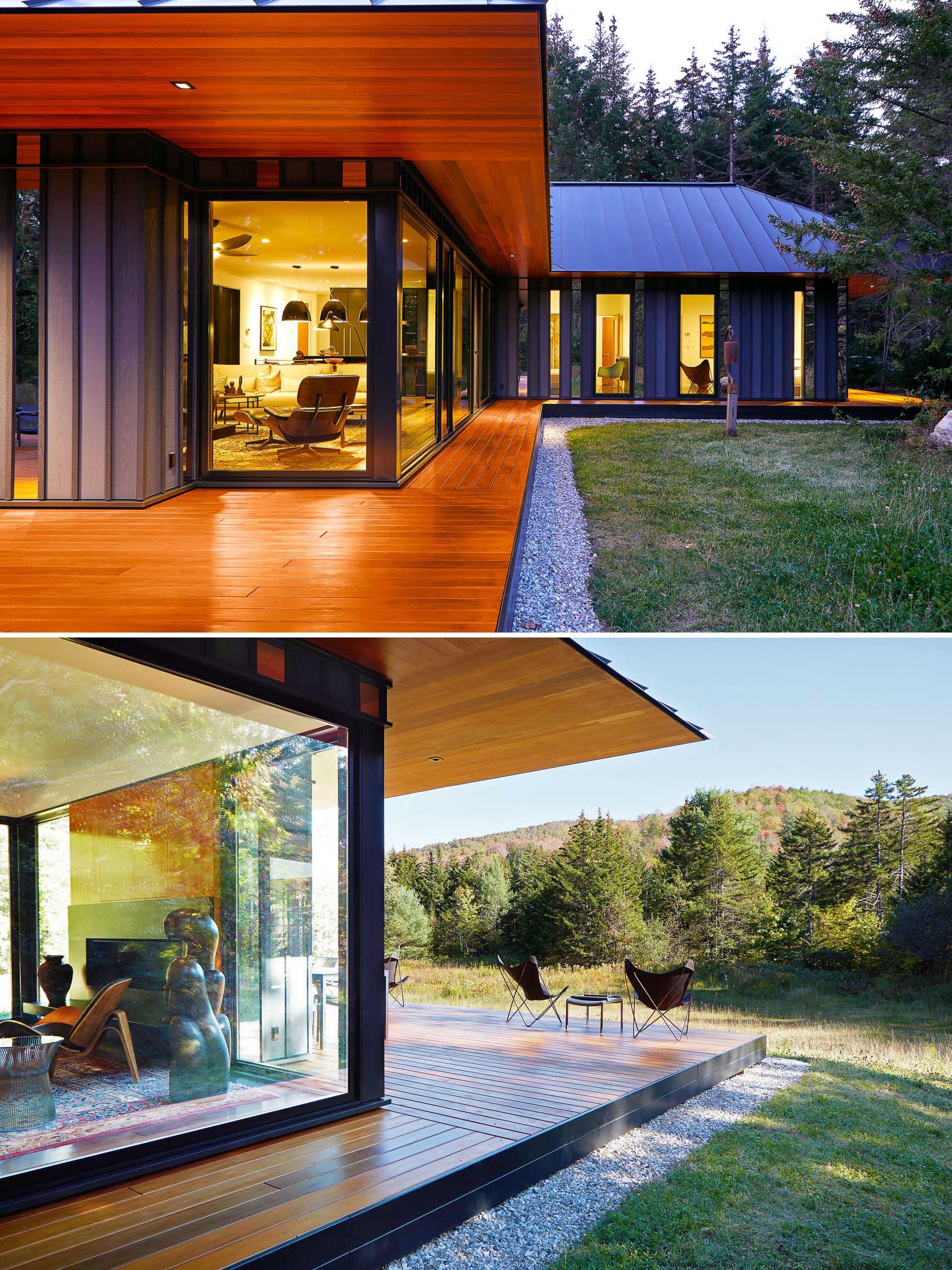 This modern home has standing seam black metal roof, and a knife-edged cedar soffit that's aligned to the cedar deck below.