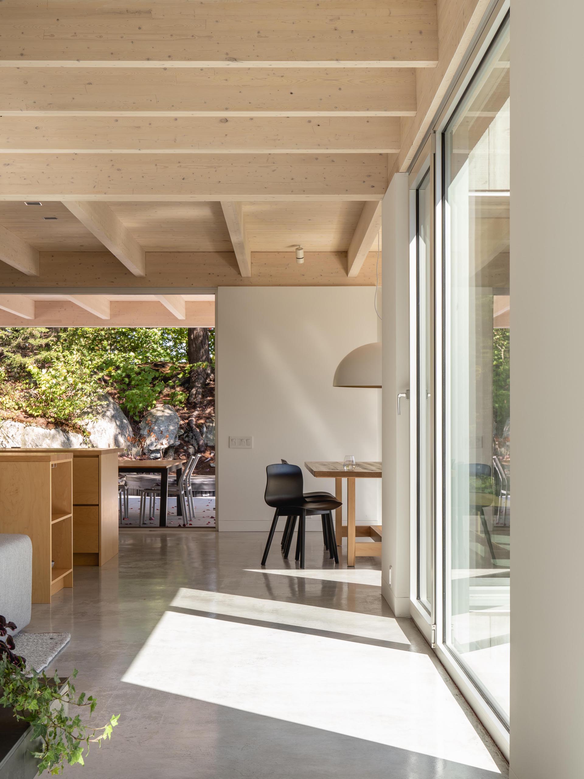 In this modern kitchen, there's two kitchen islands made from solid maple and polished concrete floors.