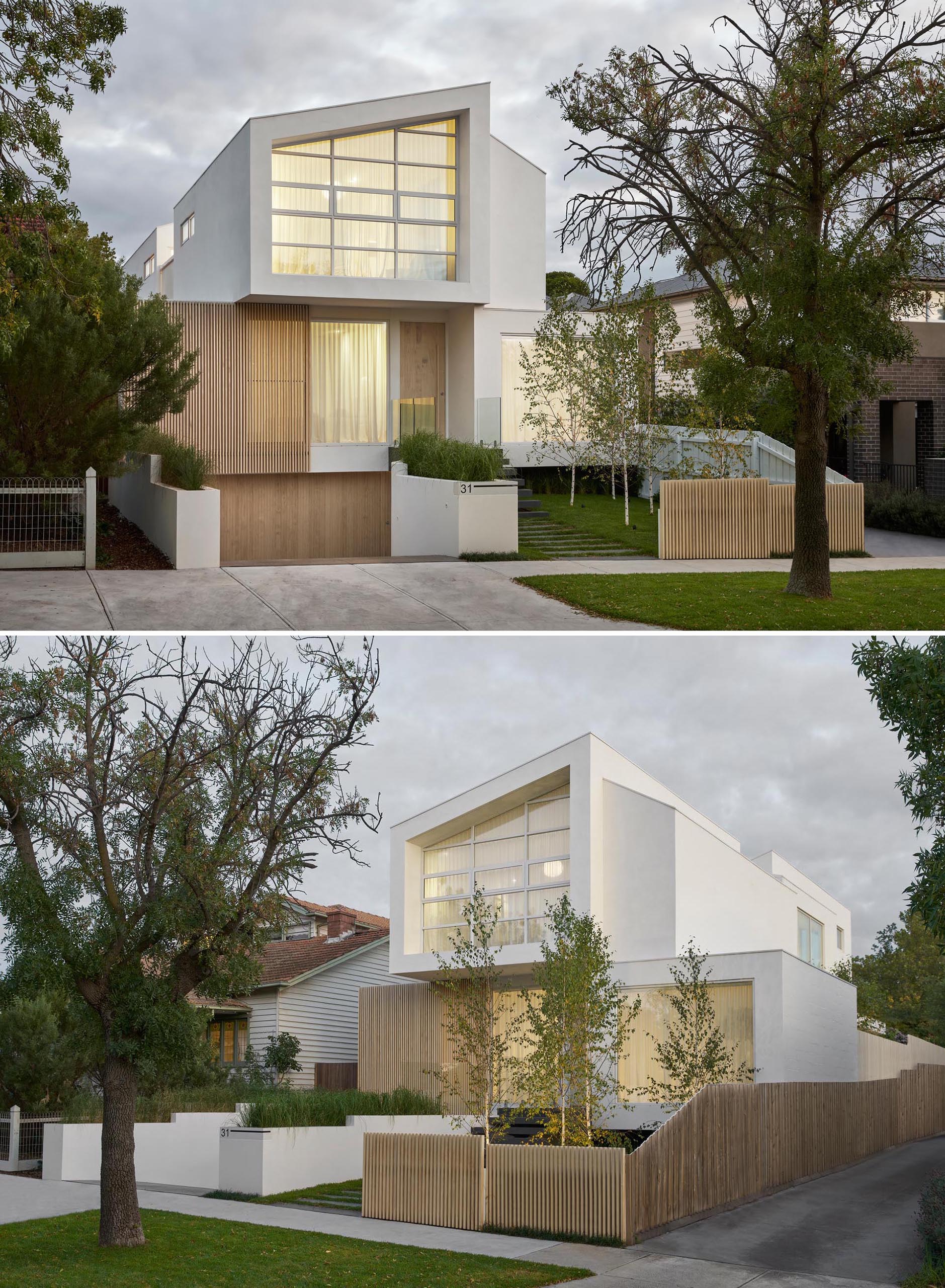 From the street, this house exterior has a path that transforms into steps that lead to the front door, while the driveway and garage are slightly hidden from view by a custom-designed planter.