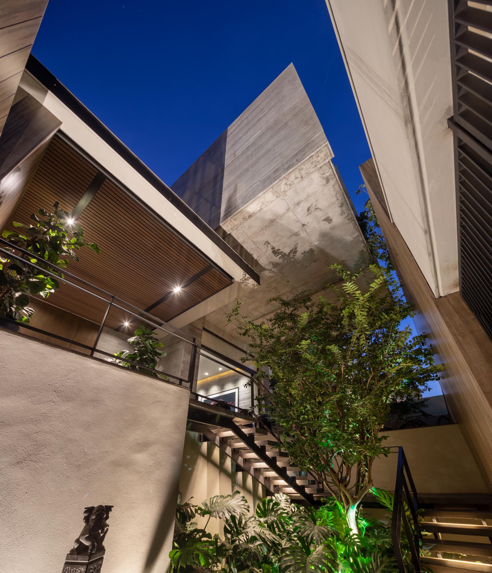 A modern concrete house with wood accents.