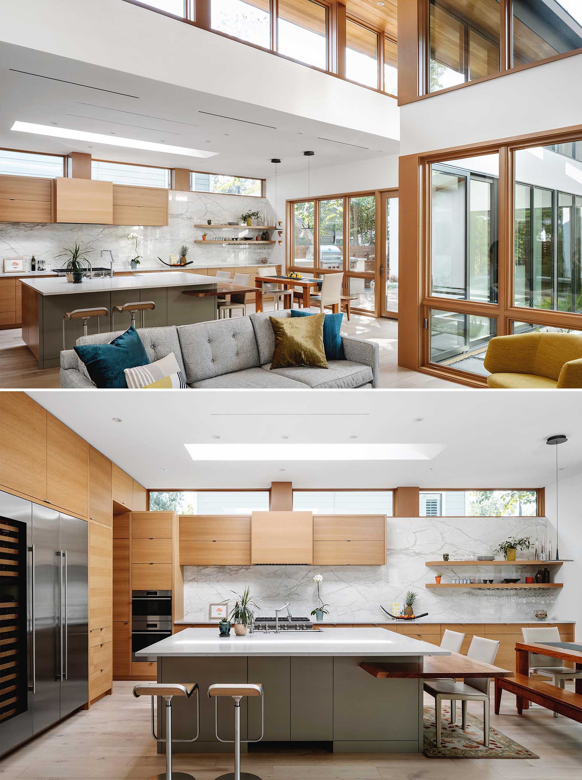 This modern kitchen has minimalist wood cabinets, a marble backsplash, and a large island with a couple of different seating options.