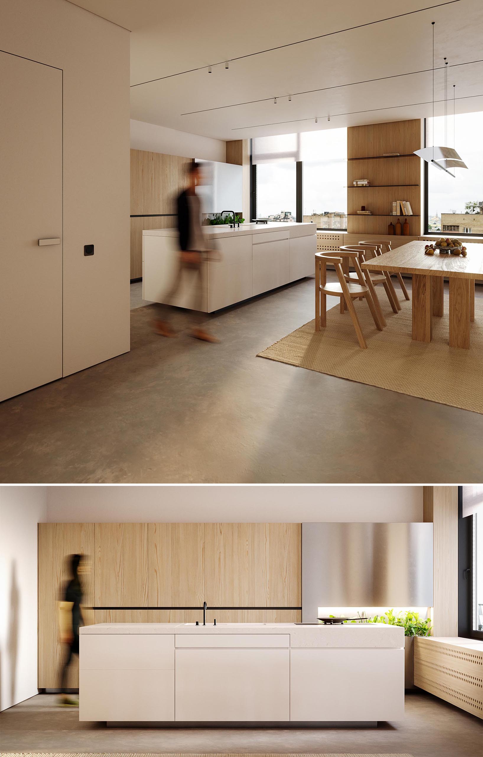 A modern kitchen with wood cabinets, a white island, and an area to grow herbs.