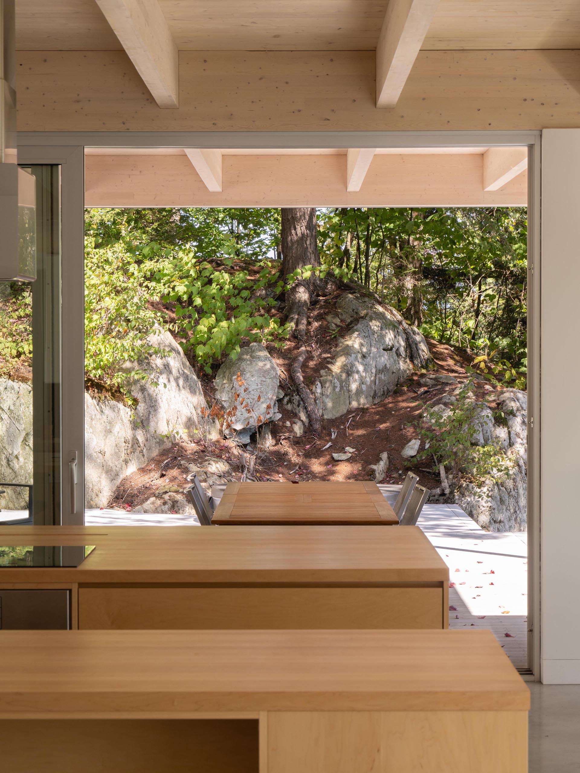 In this modern kitchen, there's two kitchen islands made from solid maple and polished concrete floors.