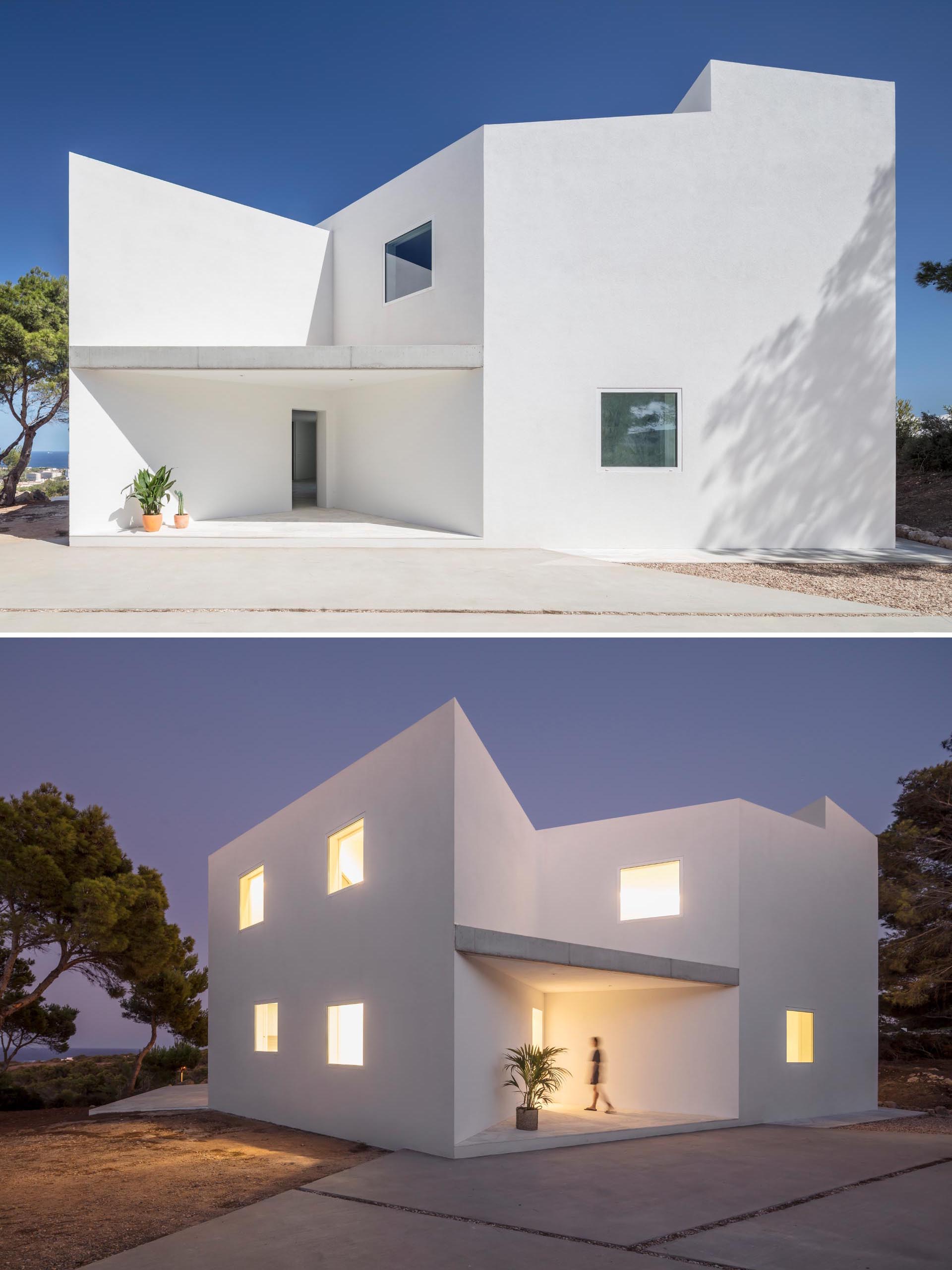 A modern white home with an angular design.