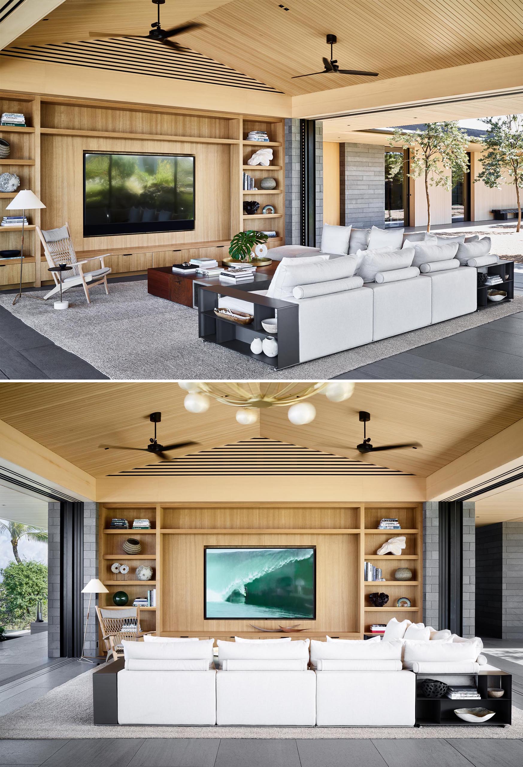 In this modern living room, a custom wood shelving unit takes up the entire wall, and light colored furniture like the sofa and accent chair, contrast the darker elements.