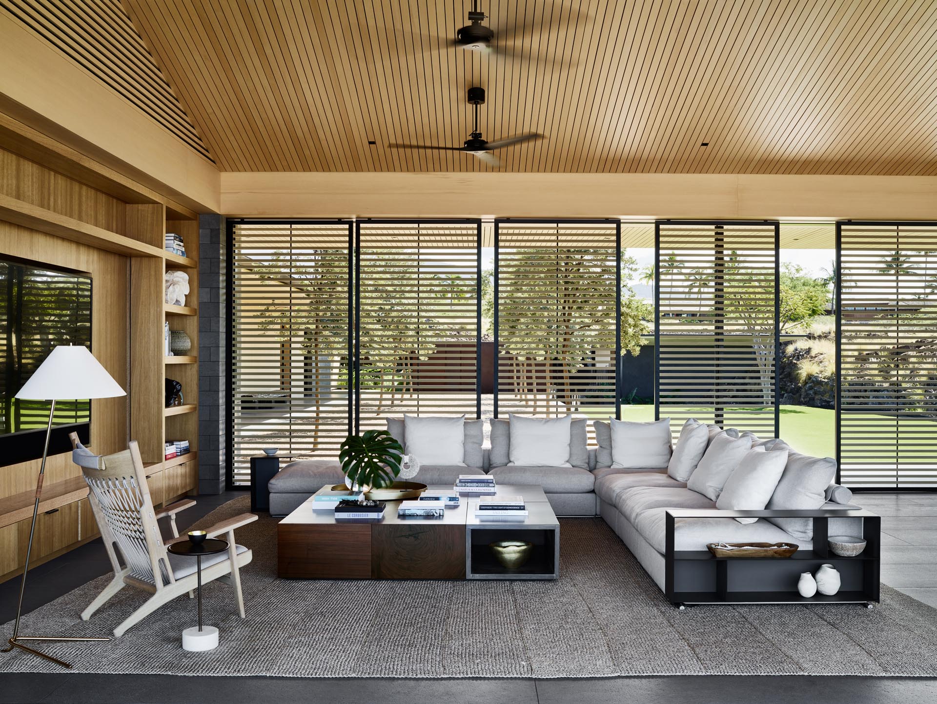 Screens provide shade from the sun in the living room.