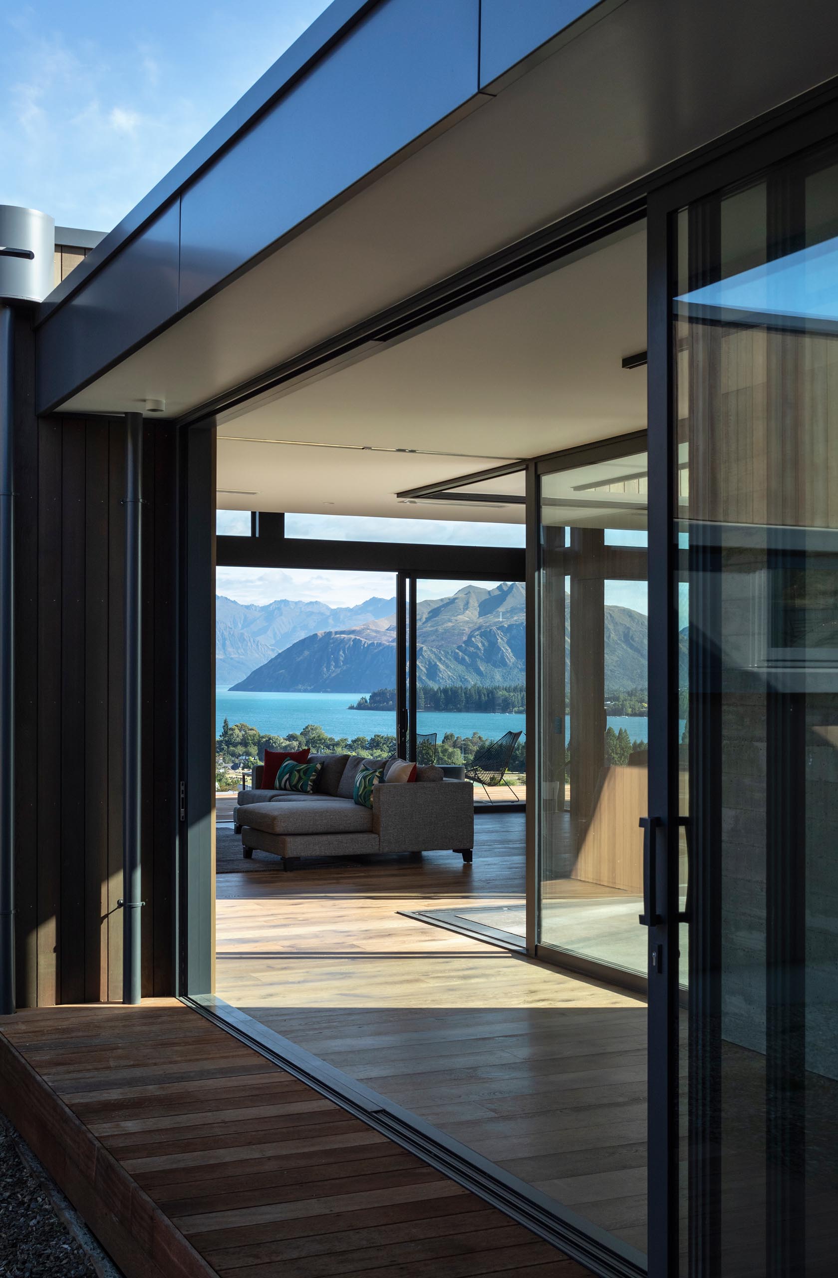 Large sliding glass doors open this home interior to the outdoors.