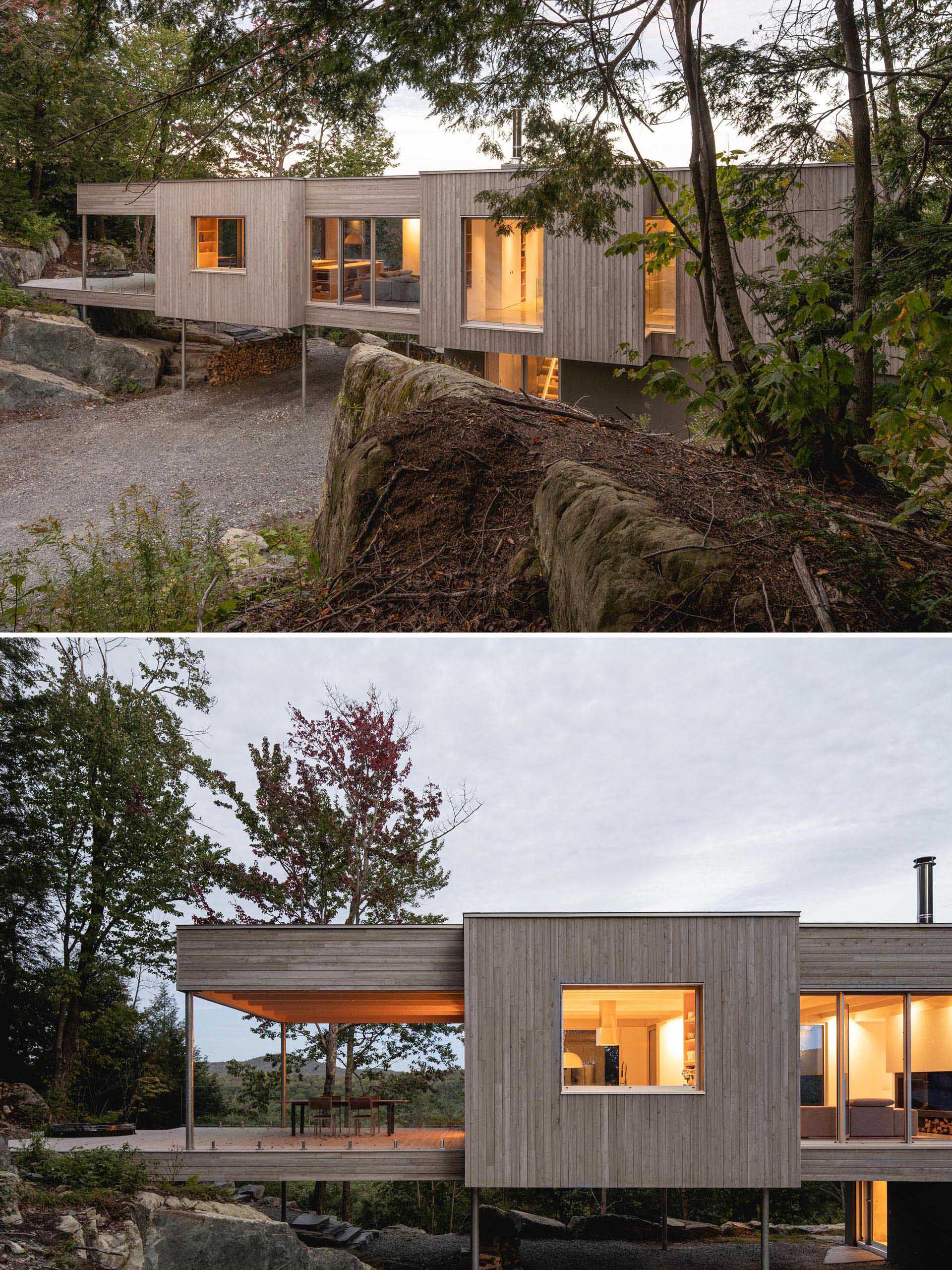 This modern house in the forest is clad in eastern white cedar, which was pretreated with a product that accelerates the greying process