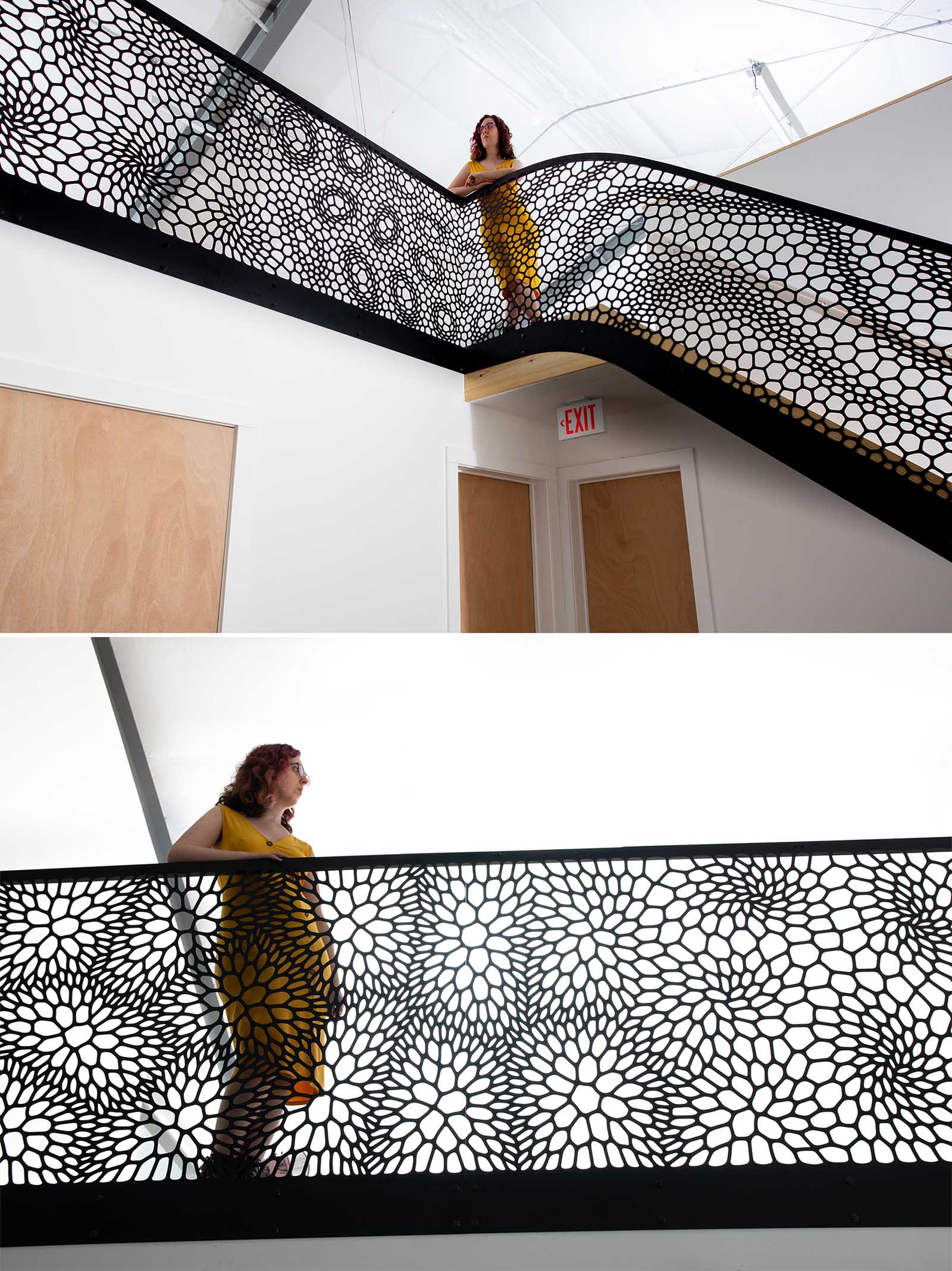 An artistic laser cut staircase railing with a matte black finish.