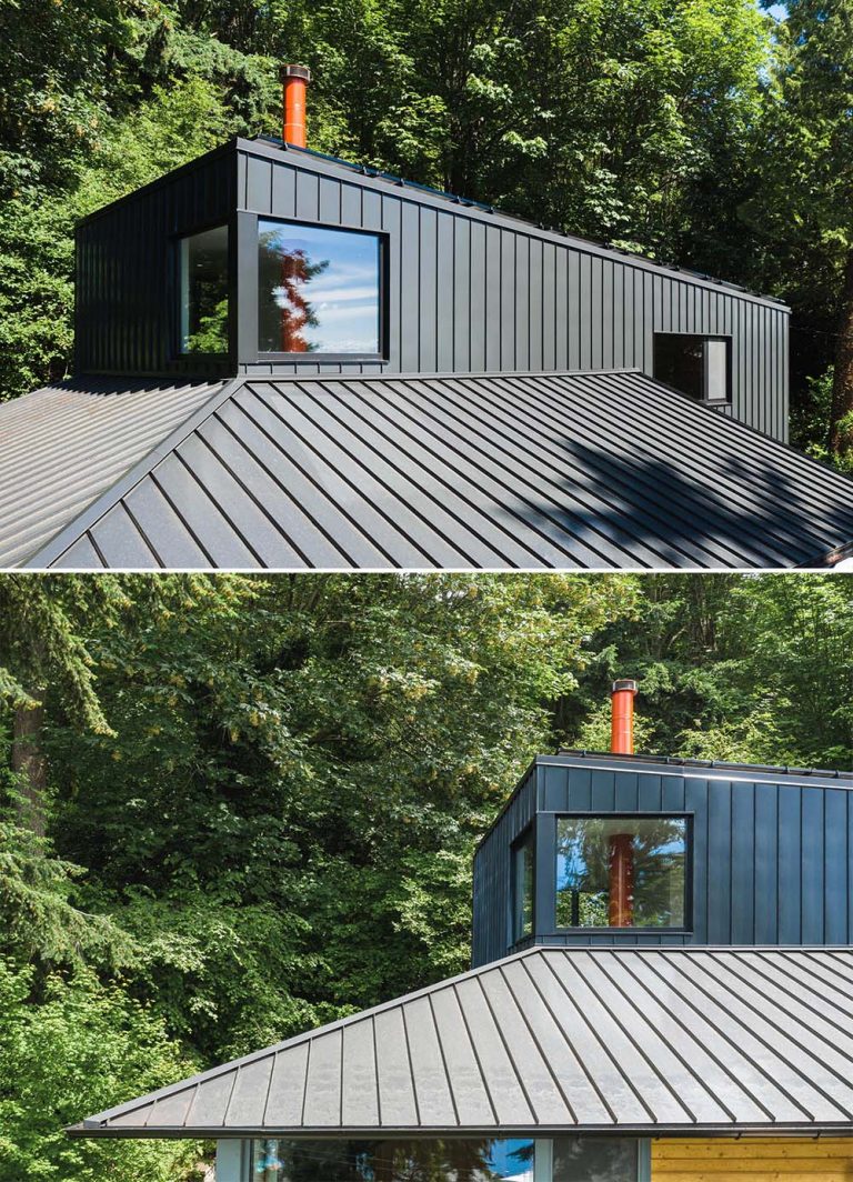 The Black Exterior Of This Remodeled Home Leads To A Warm Wood Interior
