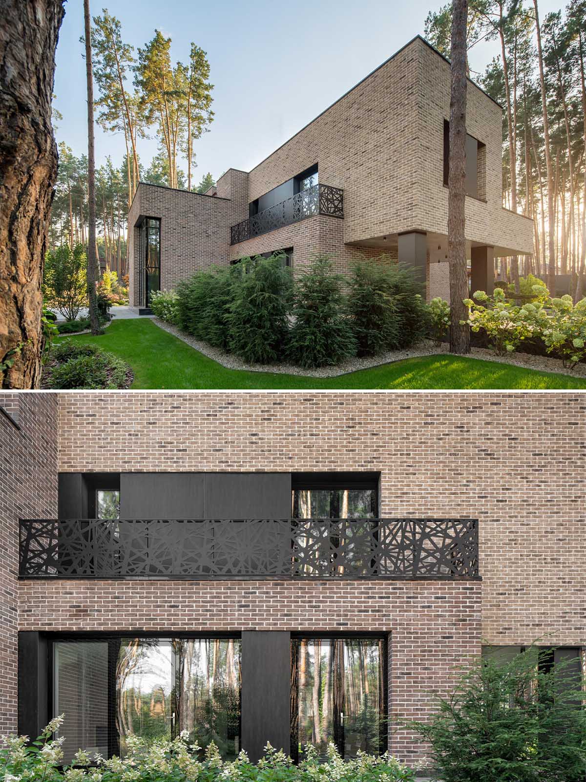 Complementing and contrasting the brown brick of this home are the black steel window frames, panels, and balcony railing.