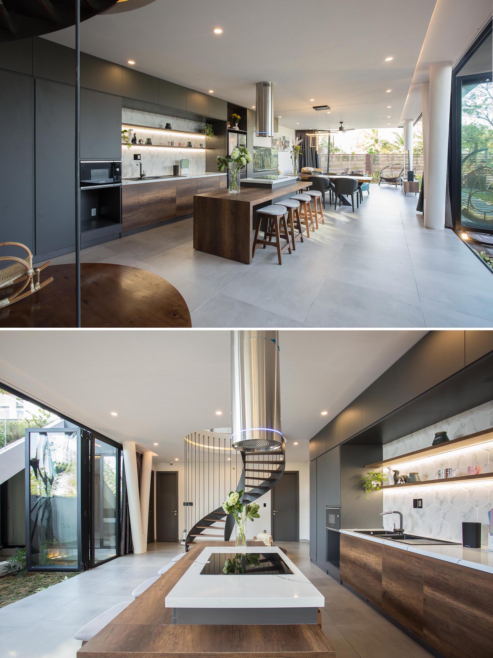 A modern kitchen with gray cabinets, light countertops, and wood accents.