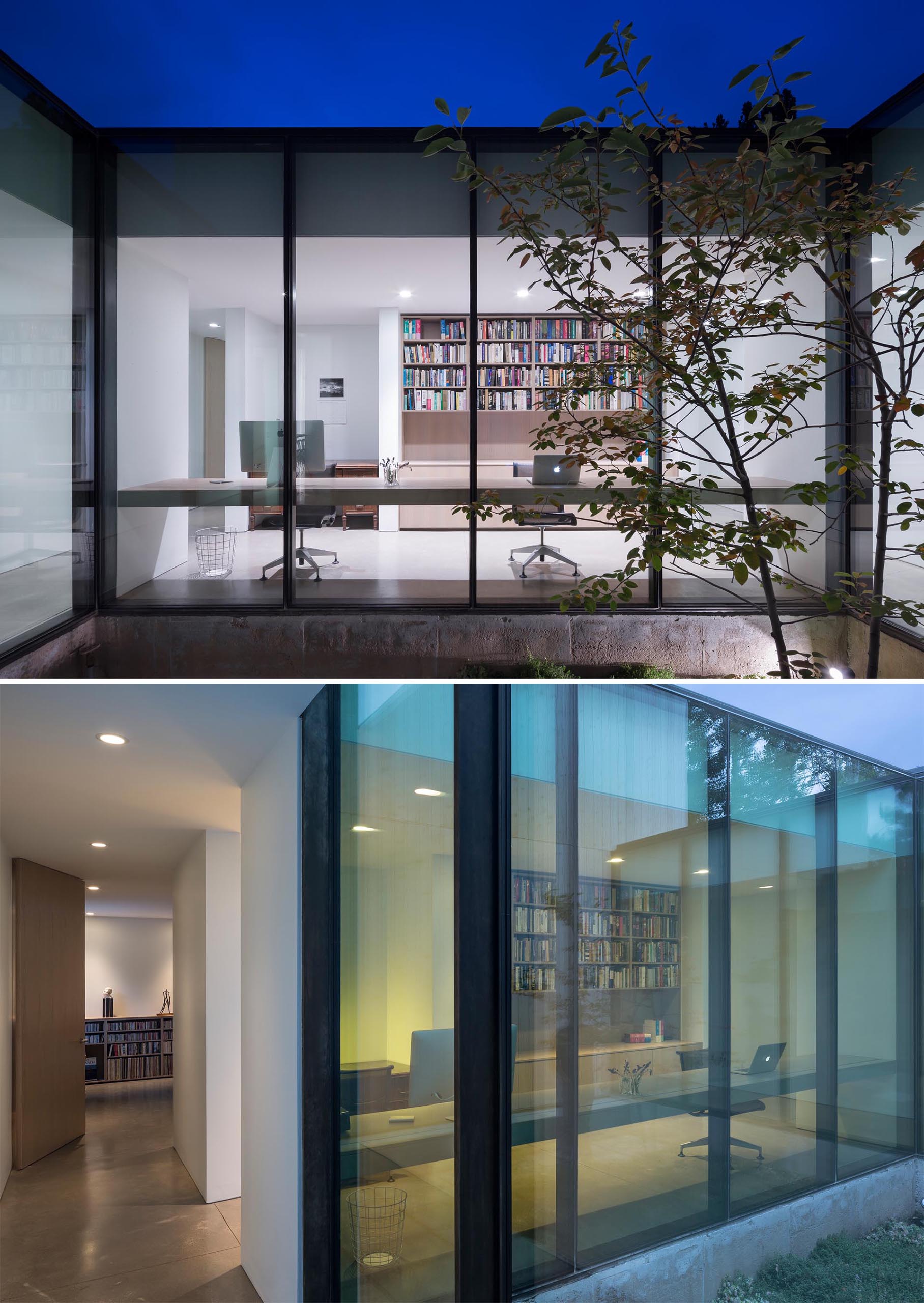 A modern home office located in a hallway that's lined with floor-to-ceiling windows.