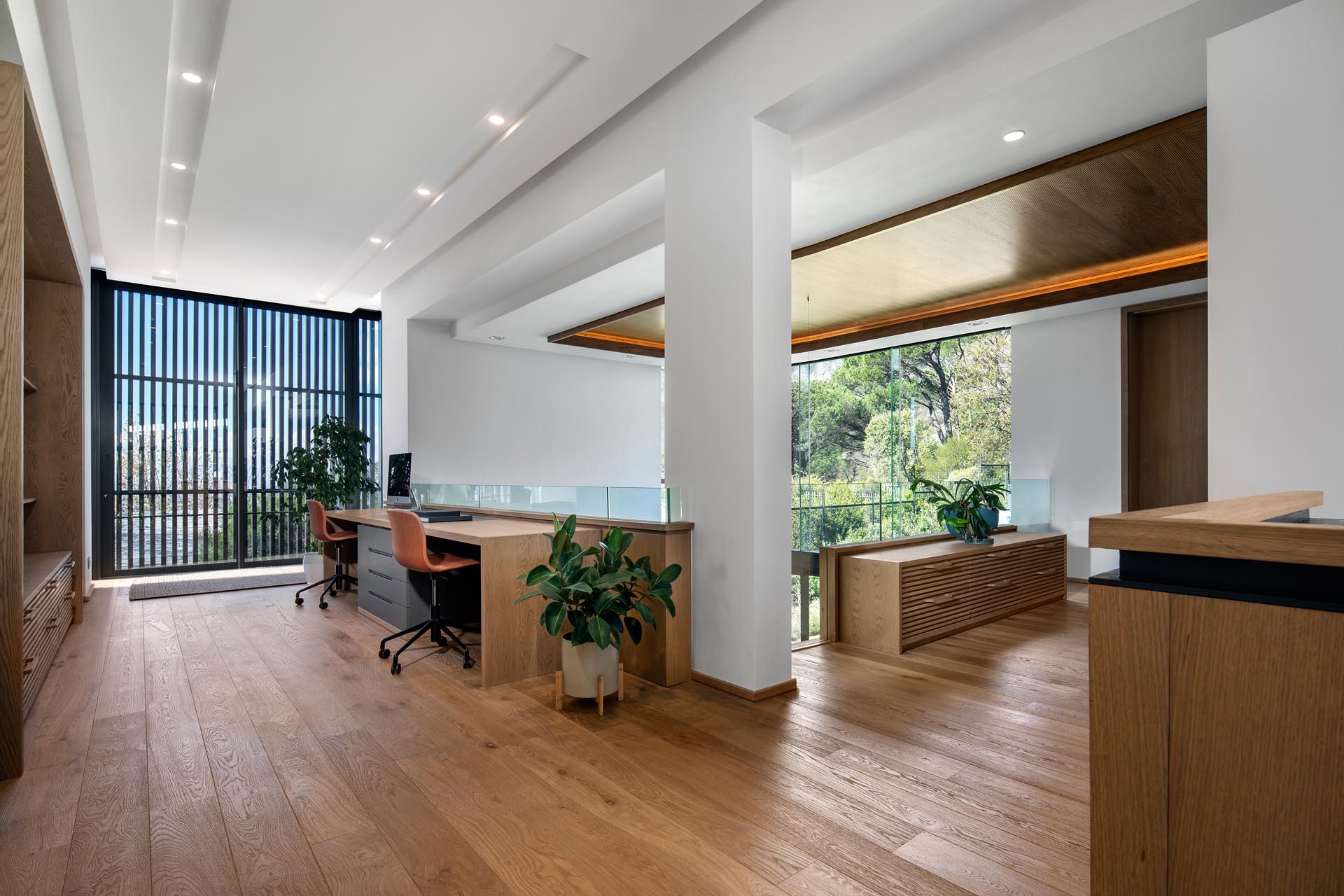 A modern home office with room for two people.