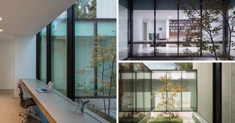 A Home Office Was Made Possible By Building A Desk Along A Wall Of Windows Inside This House
