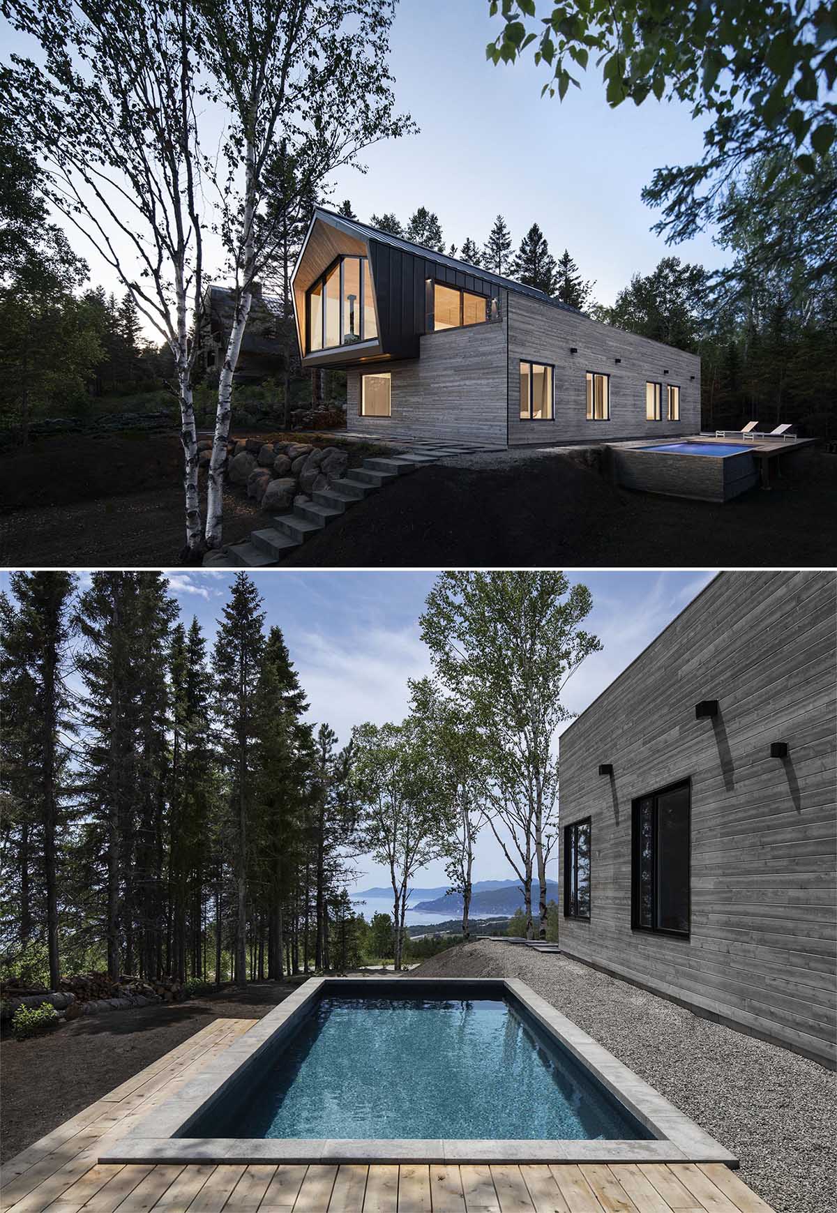 A modern home with a black metal and wood exterior, and a swimming pool.