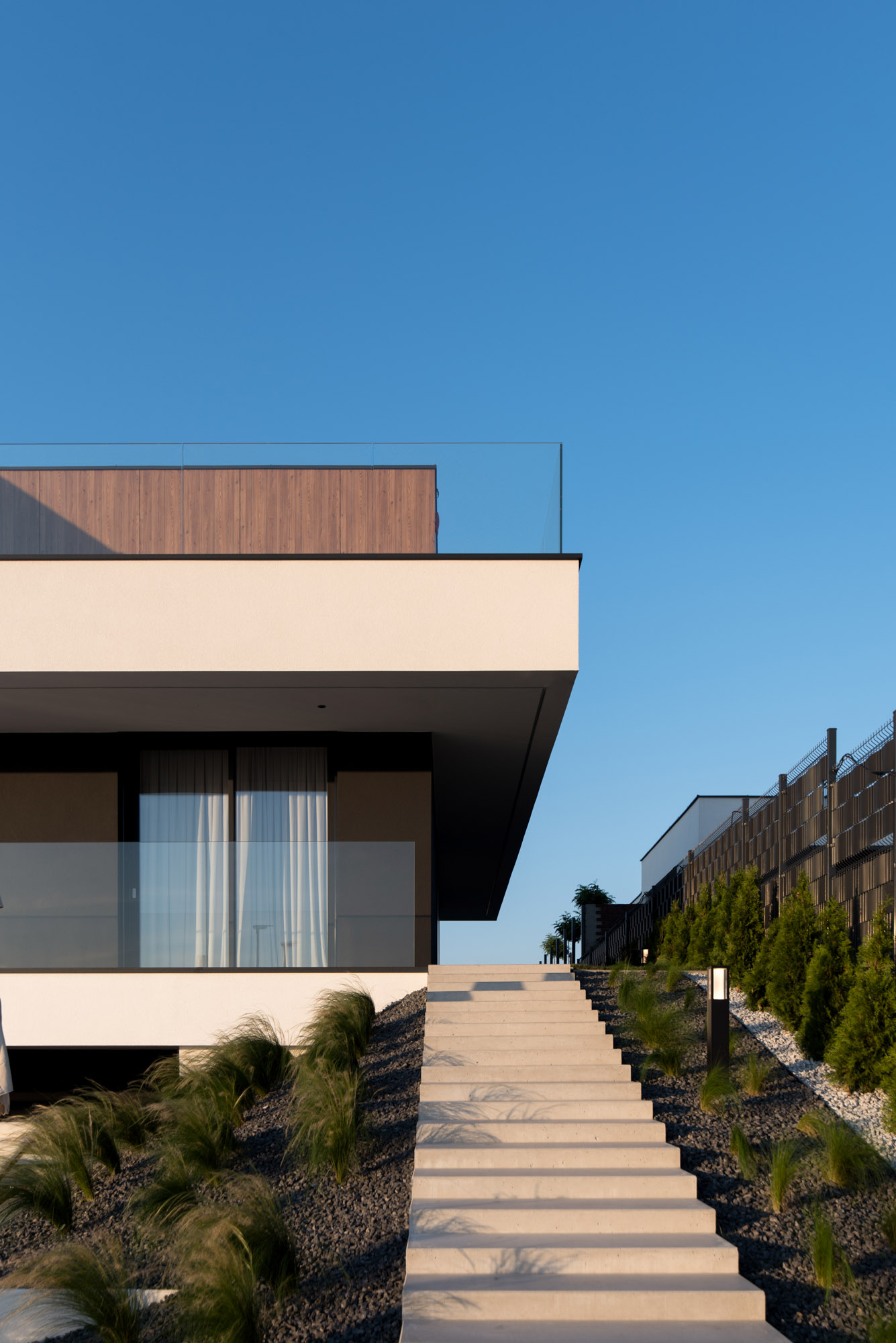 A modern house with exterior stairs.