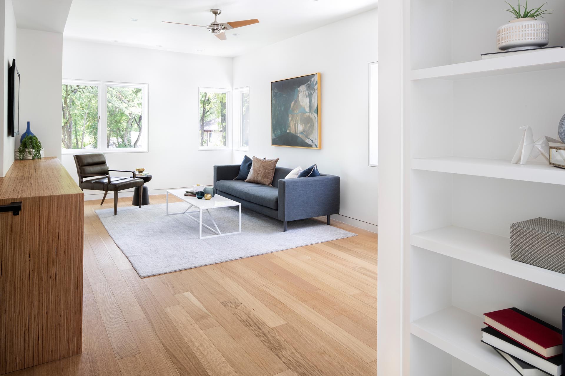 A modern family room with wood floors.