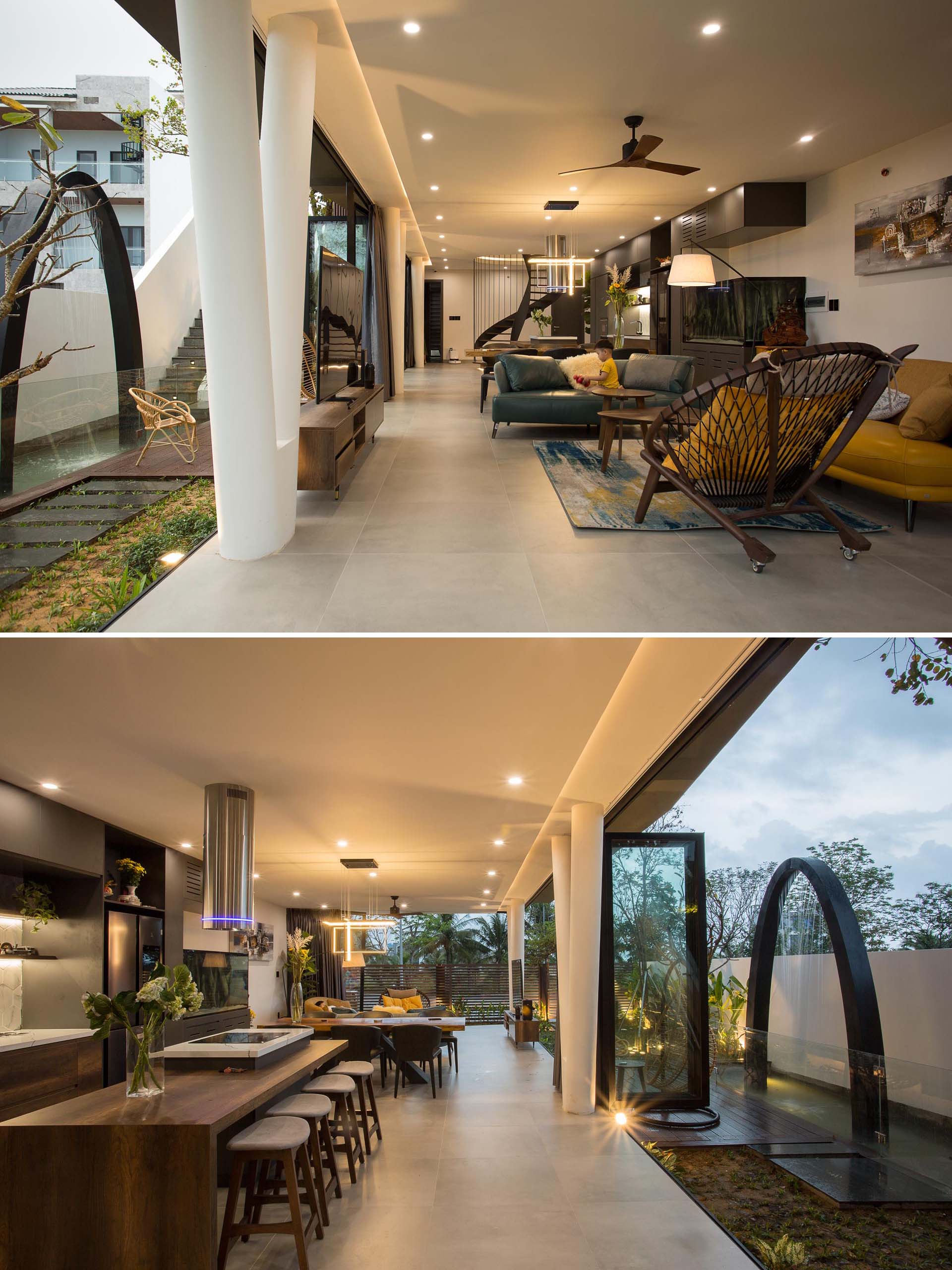 The interior of this modern home has the living room, dining room, and kitchen connected to create big and flexible space.