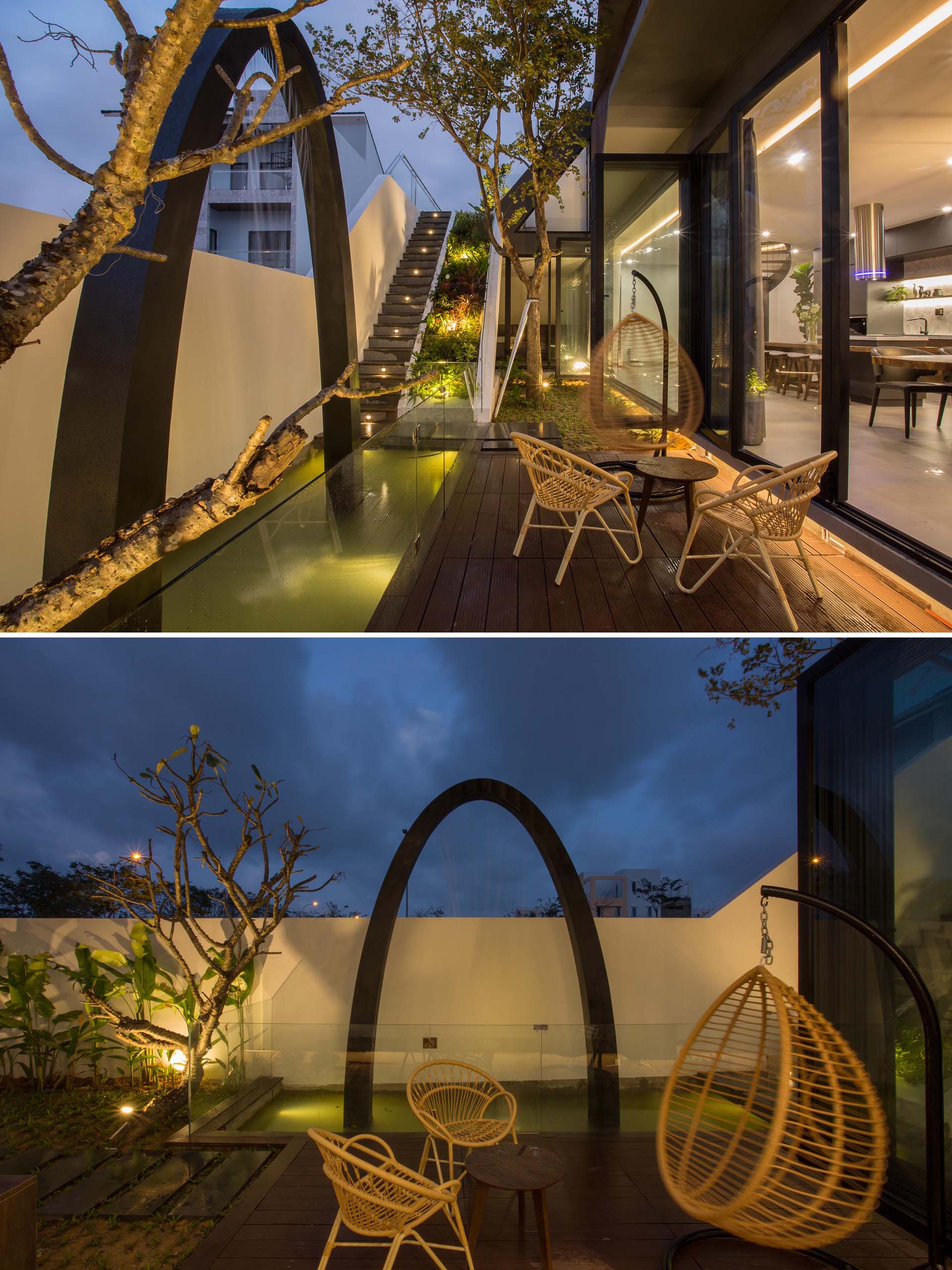 A modern home with a small patio and water feature, has stairs that lead to a rooftop vegetable garden.