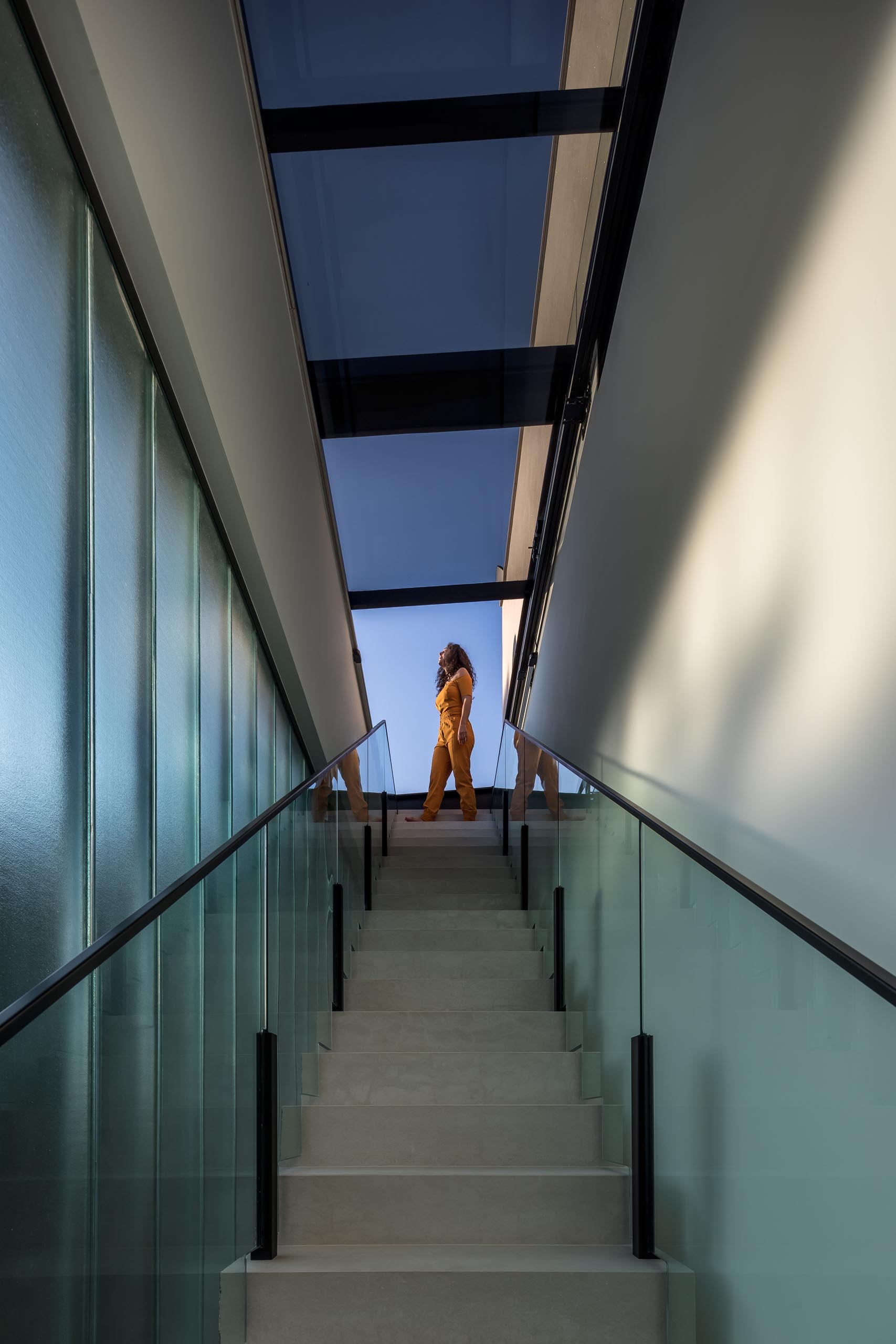 A modern staircase with skylights.