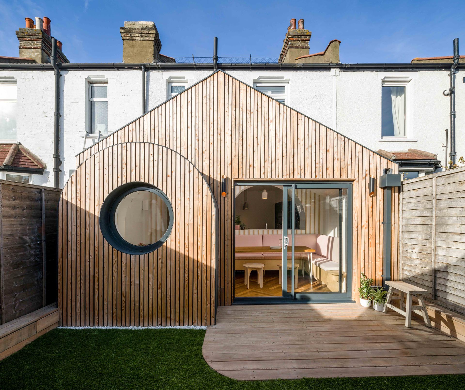 This modern house addition features tongue-and-groove larch cladding.