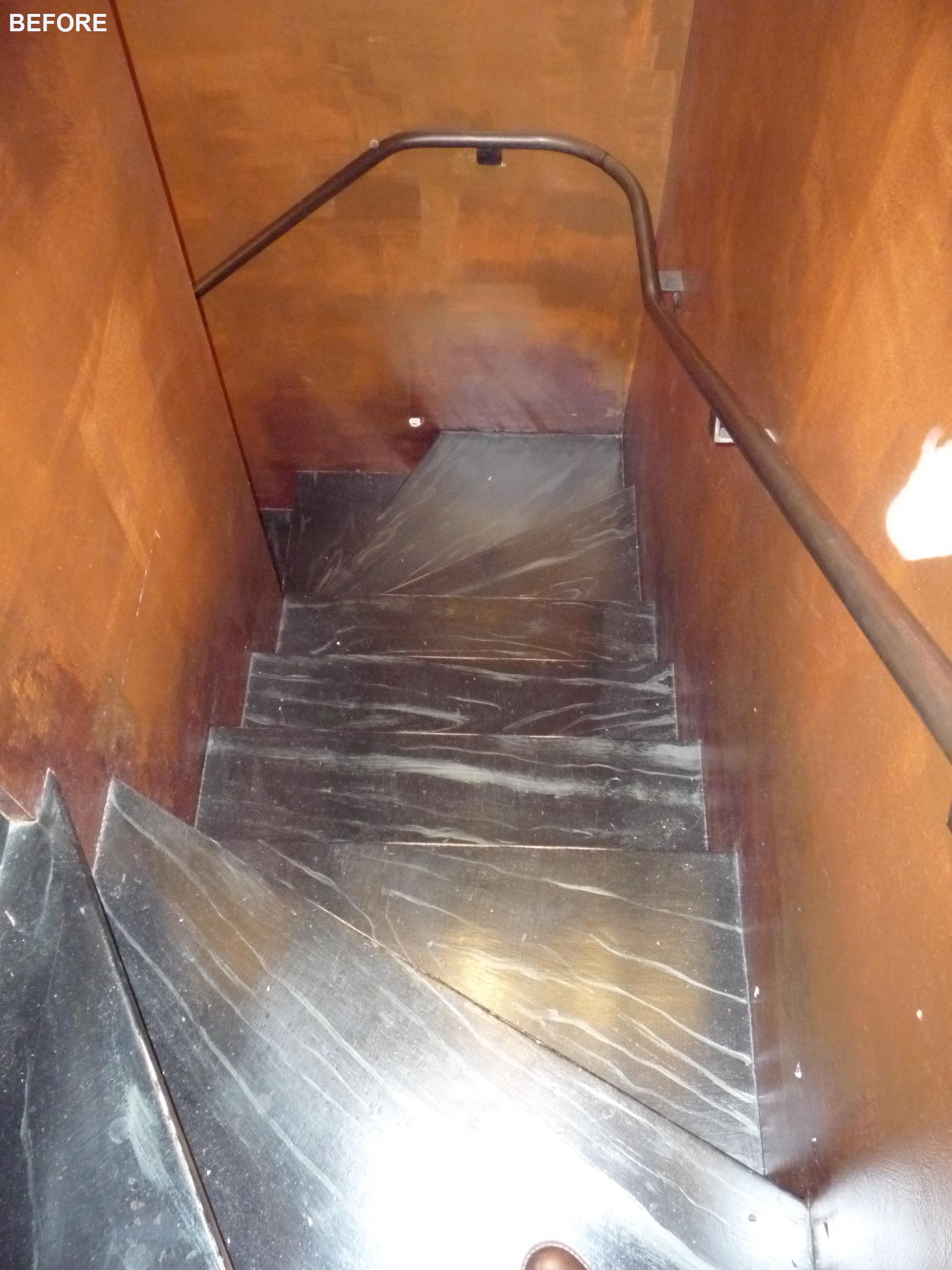 A metal staircase before it was remodeled.