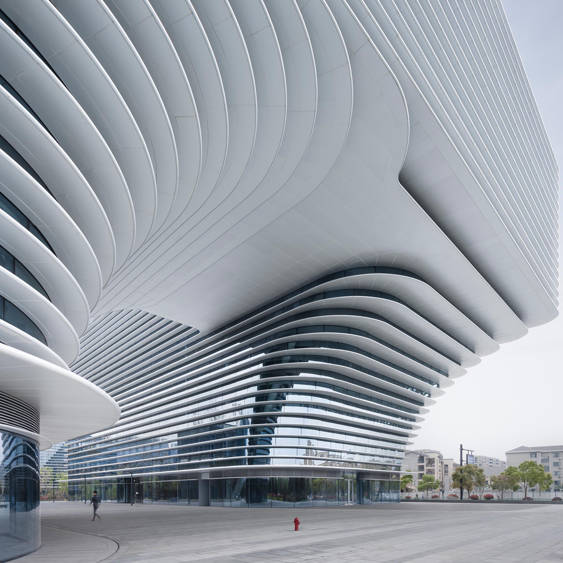 A modern white building named 'Cloud Park', designed by Meng Fanhao.