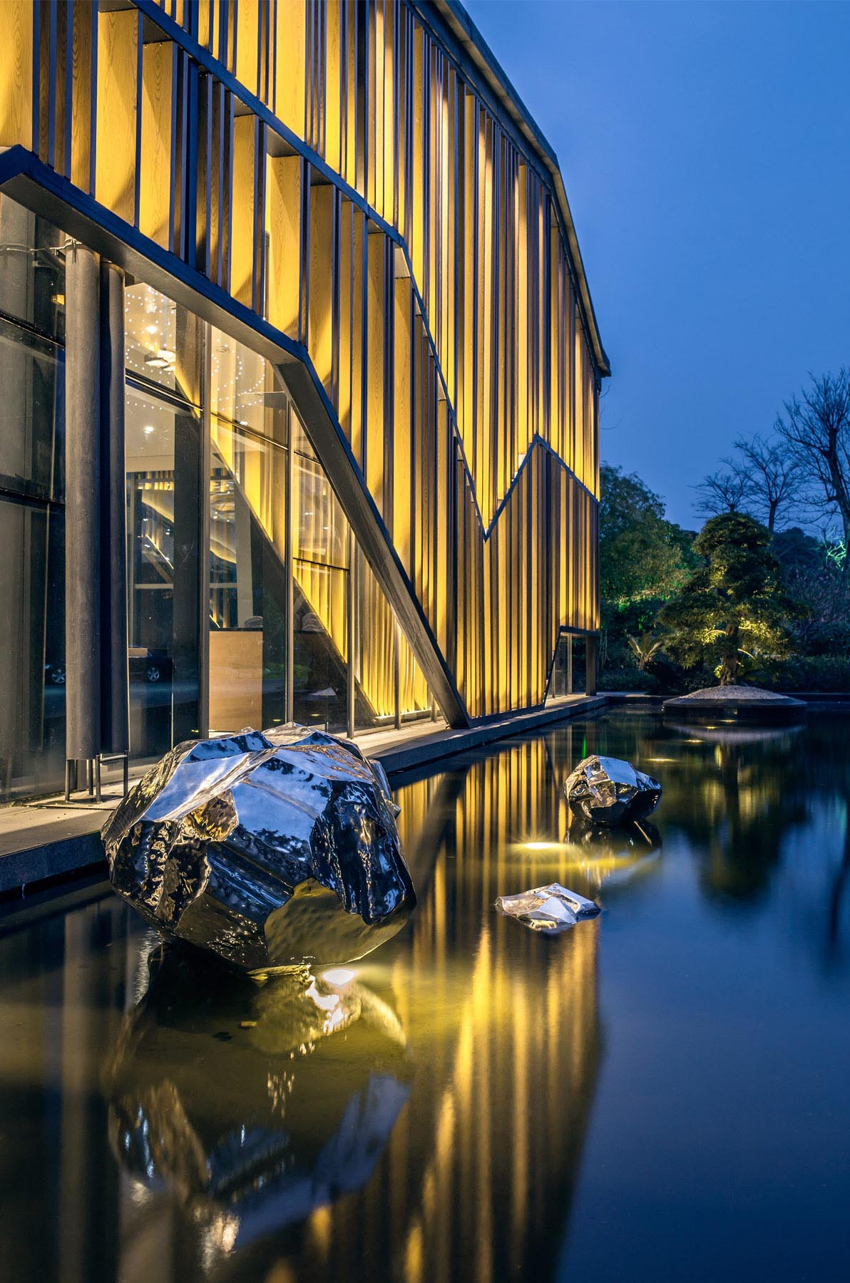 A modern building with a water feature.